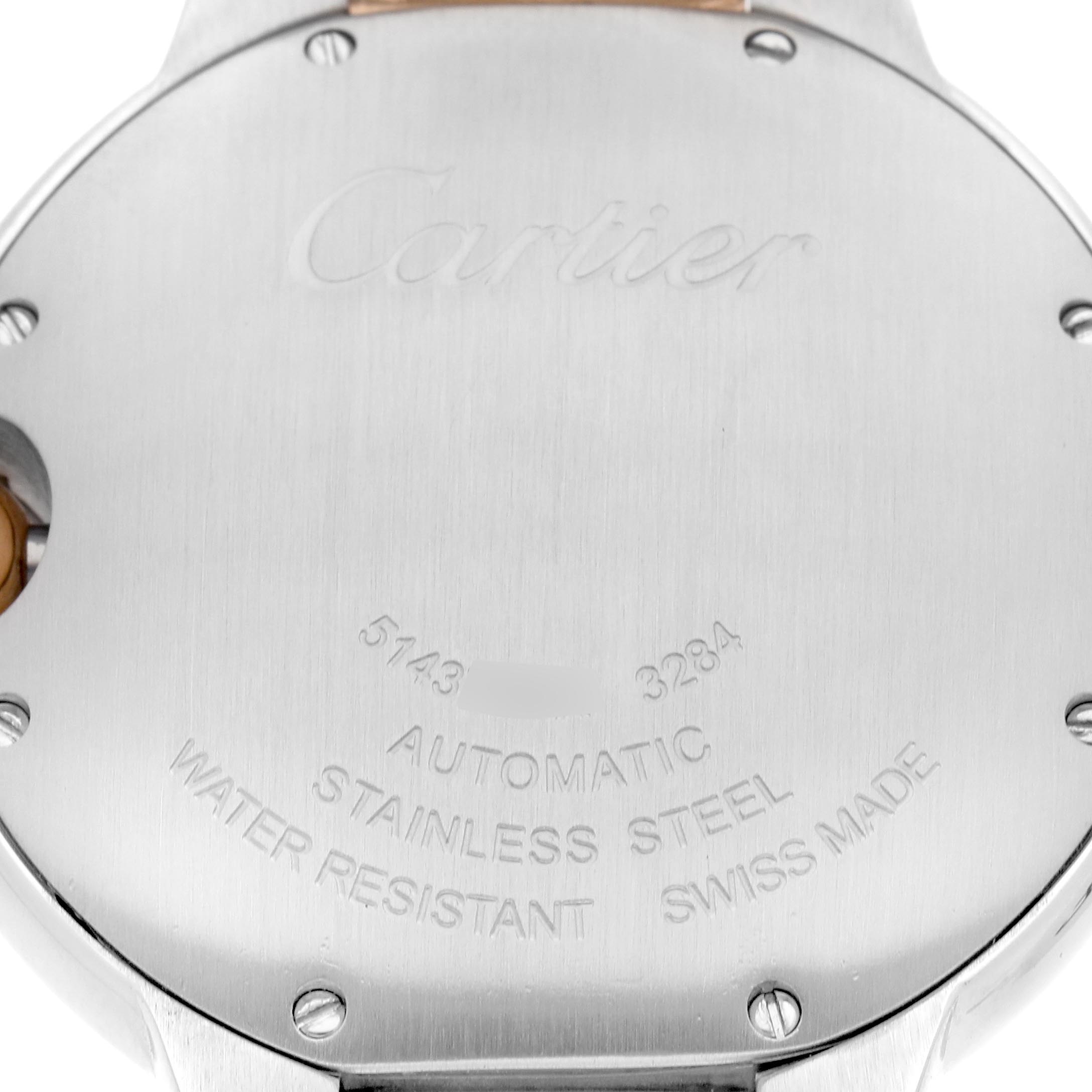 The image shows the back case of a Cartier Ballon Bleu W3BB0018 Women
s Steel and Gold (two tone) White Dial W3BB0018 Women
s Steel and Gold (two tone) White Dial watch, displaying engravings and screws.