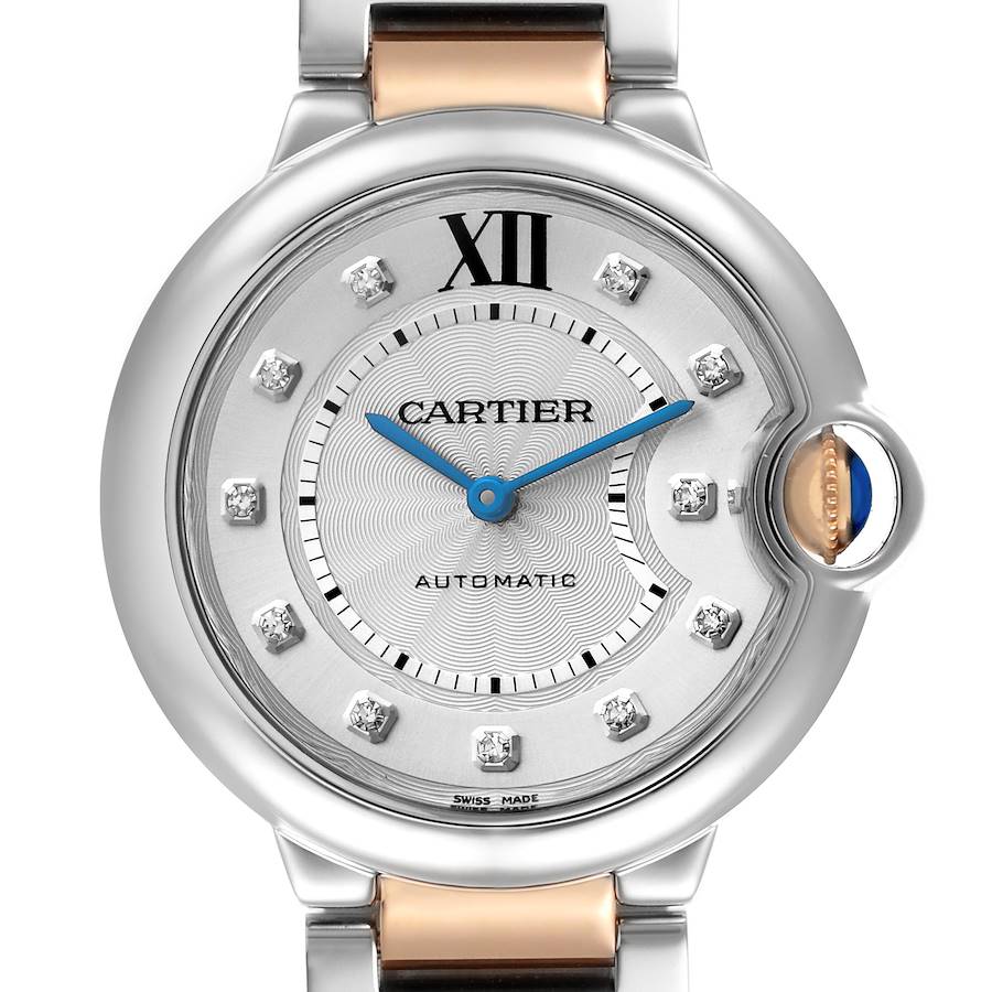 The image shows a close-up of the Cartier Ballon Bleu watch face, highlighting the dial, hands, and crown from a front angle.