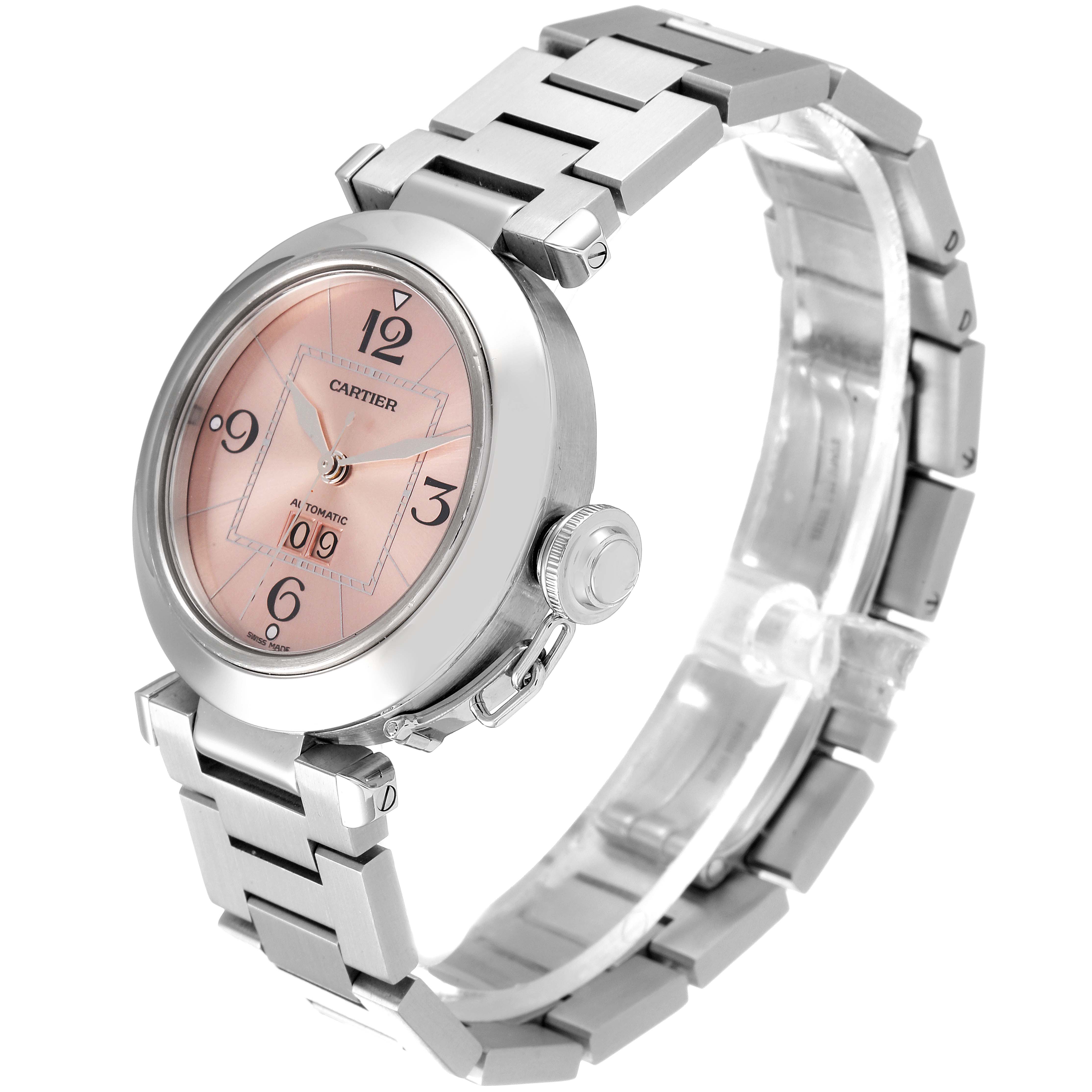 The Cartier Pasha W31058M7 Women's Stainless Steel Pink Dial W31058M7 Women's Stainless Steel Pink Dial watch is shown at an angle showcasing the face, bracelet, and crown, highlighting its design and details.