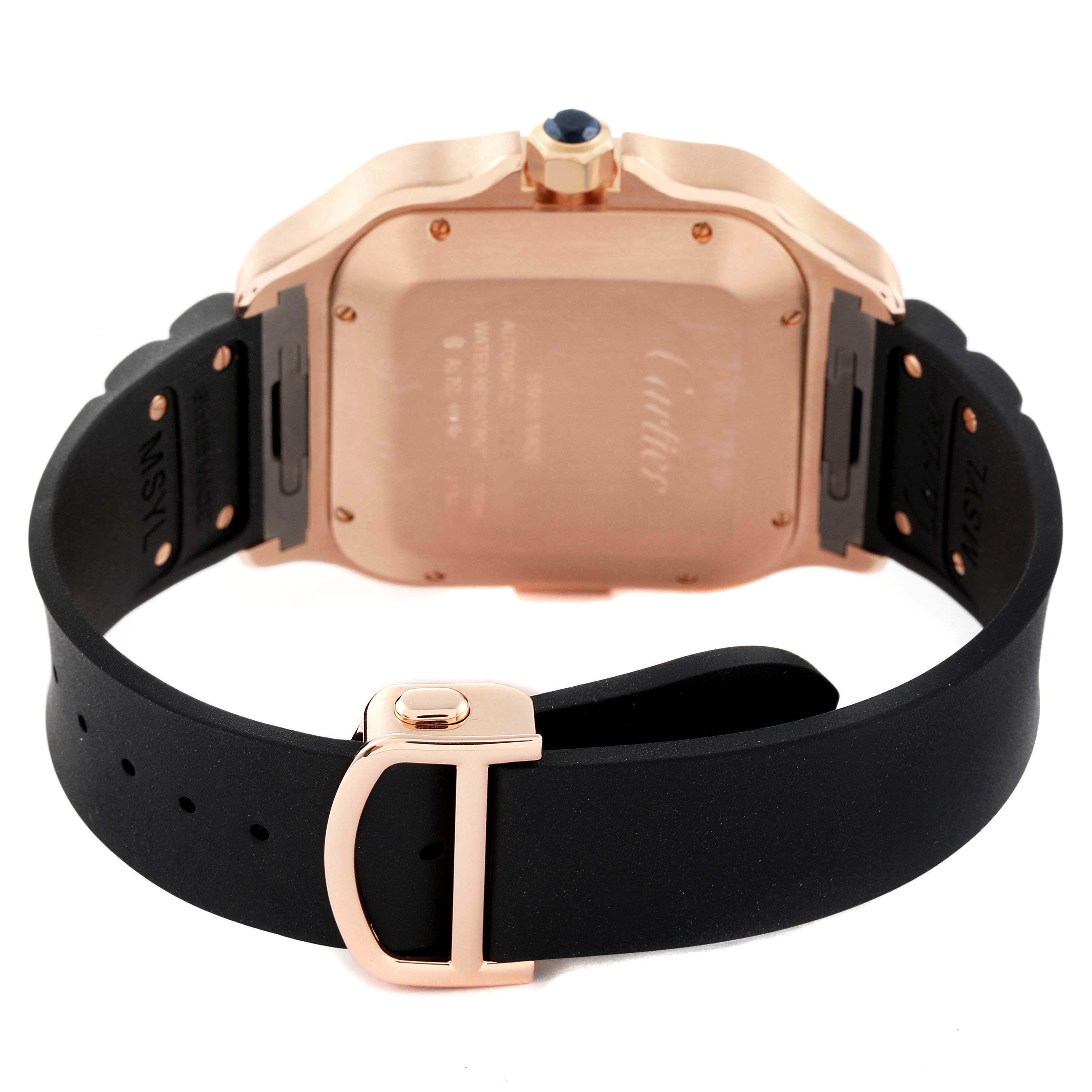 The image shows the rear view of a Cartier Santos WGSA0017 Men's Rose Gold Silver Dial WGSA0017 Men's Rose Gold Silver Dial watch featuring a black strap and rose gold case.
