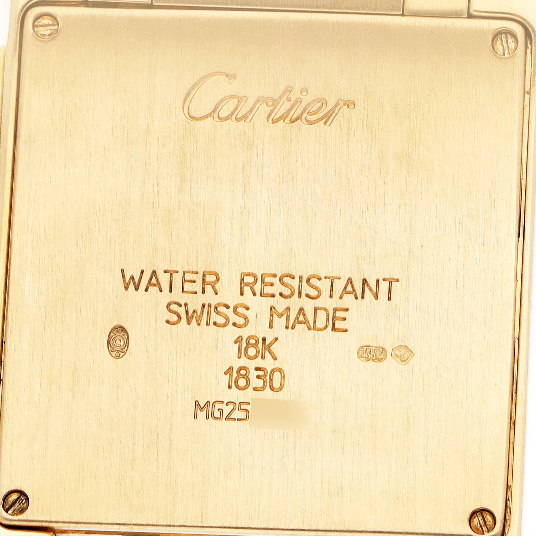 The image shows the back of a Cartier Tank Française watch, displaying engravings and markings.