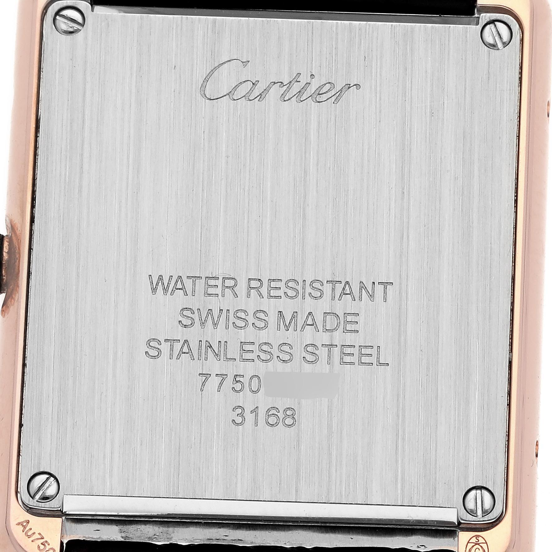 The image shows the back of a Cartier Tank Solo W5200024 Women
s Steel and Gold (two tone) Silver Dial W5200024 Women
s Steel and Gold (two tone) Silver Dial watch, highlighting its stainless steel back and branding details.