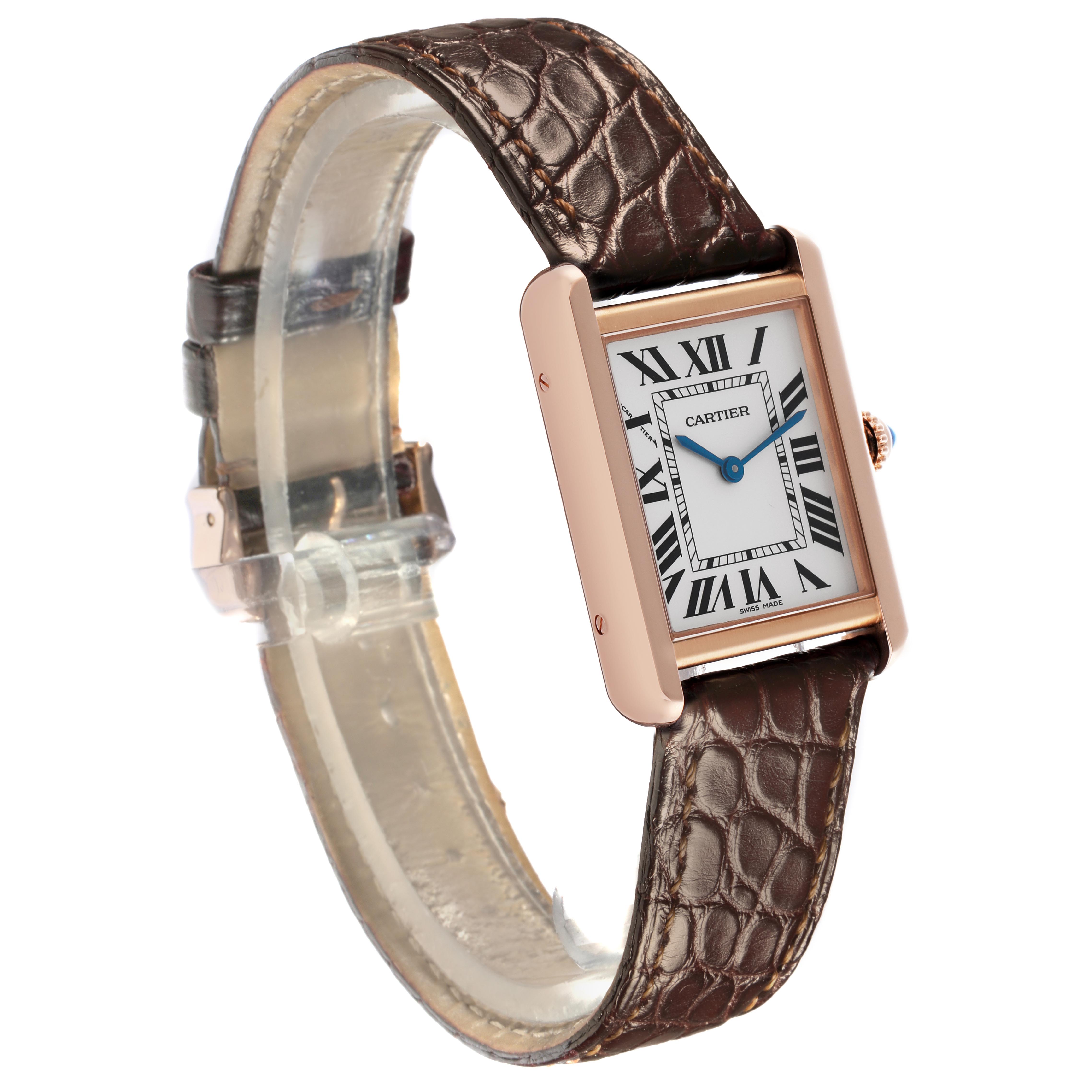 The Cartier Tank Solo W5200024 Women
s Steel and Gold (two tone) Silver Dial W5200024 Women
s Steel and Gold (two tone) Silver Dial watch is shown at a slight angle, displaying the face, Roman numerals, blue hands, crown, and leather strap.