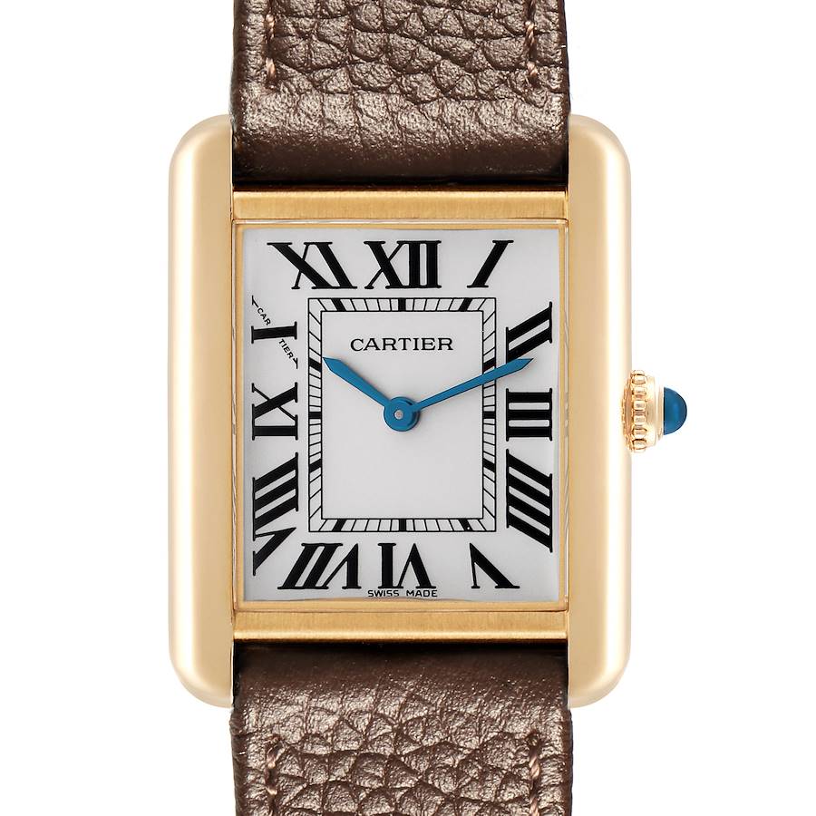 The Cartier Tank Solo watch is shown from a top view, highlighting the face, Roman numerals, gold casing, and leather strap.