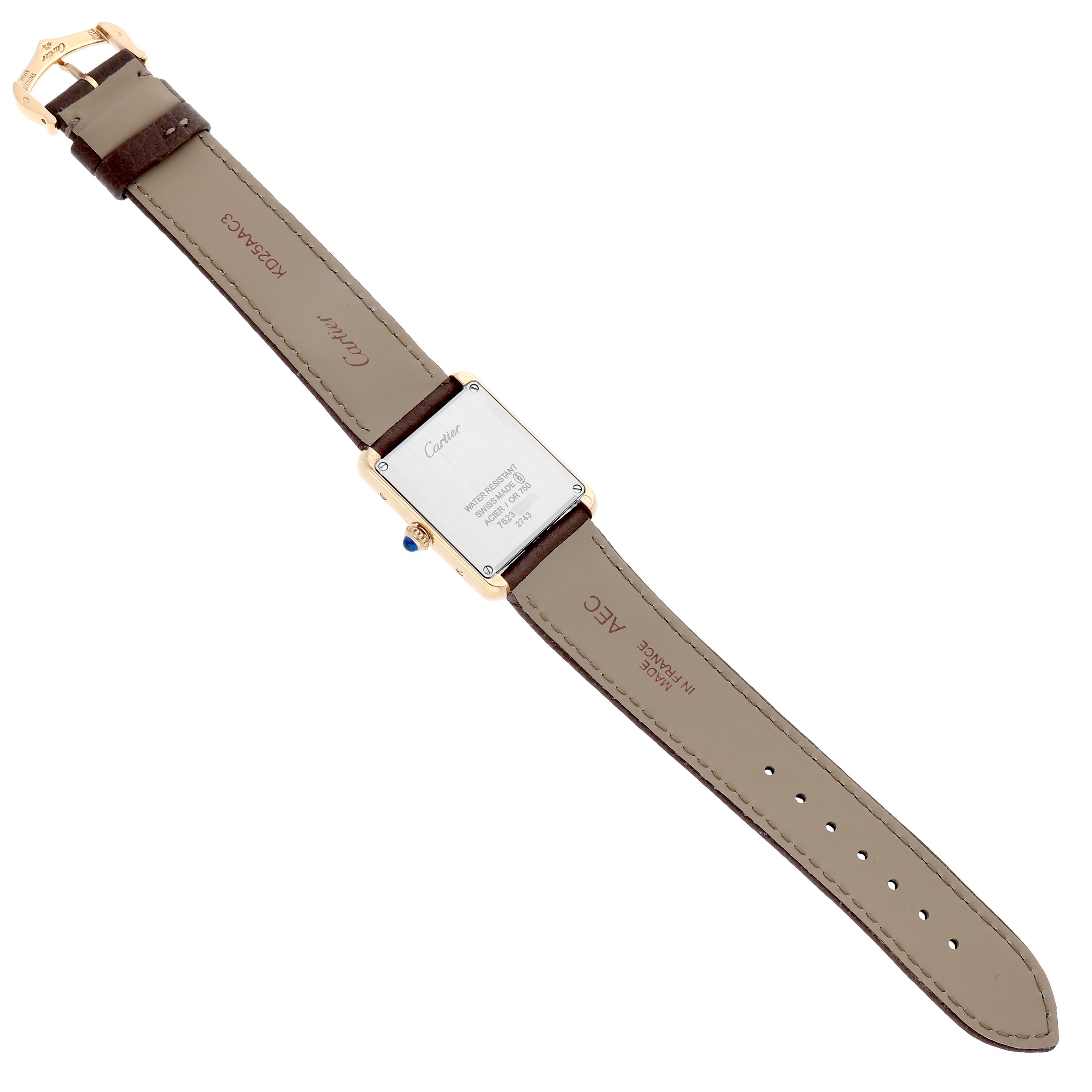 The Cartier Tank Solo W1018755 Women
s Steel and Gold (two tone) Silver Dial W1018755 Women
s Steel and Gold (two tone) Silver Dial watch is shown from the back, highlighting the case back, strap, and buckle.