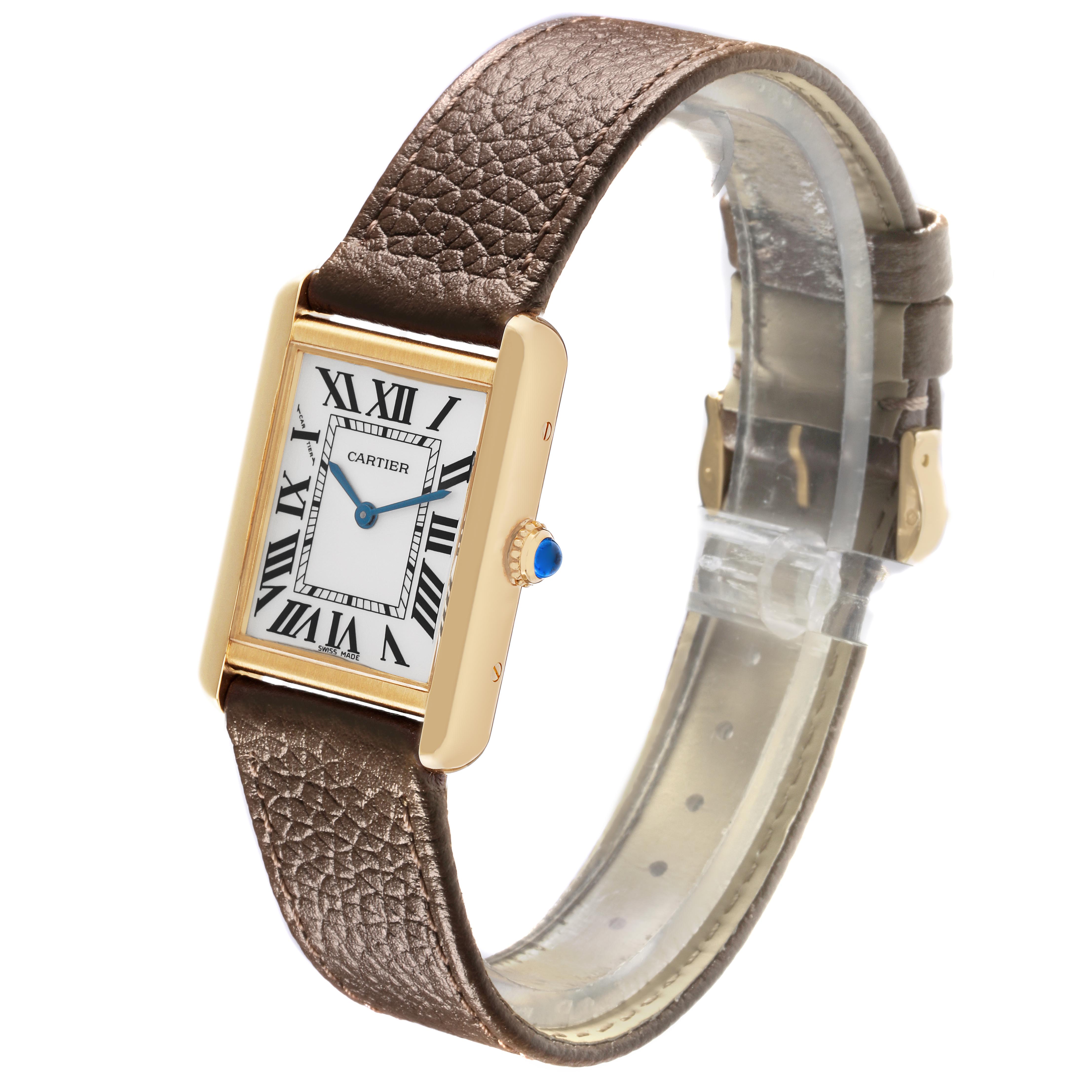 The Cartier Tank Solo W1018755 Women
s Steel and Gold (two tone) Silver Dial W1018755 Women
s Steel and Gold (two tone) Silver Dial watch is shown at an angled side view, highlighting its rectangular face, Roman numerals, and leather strap.