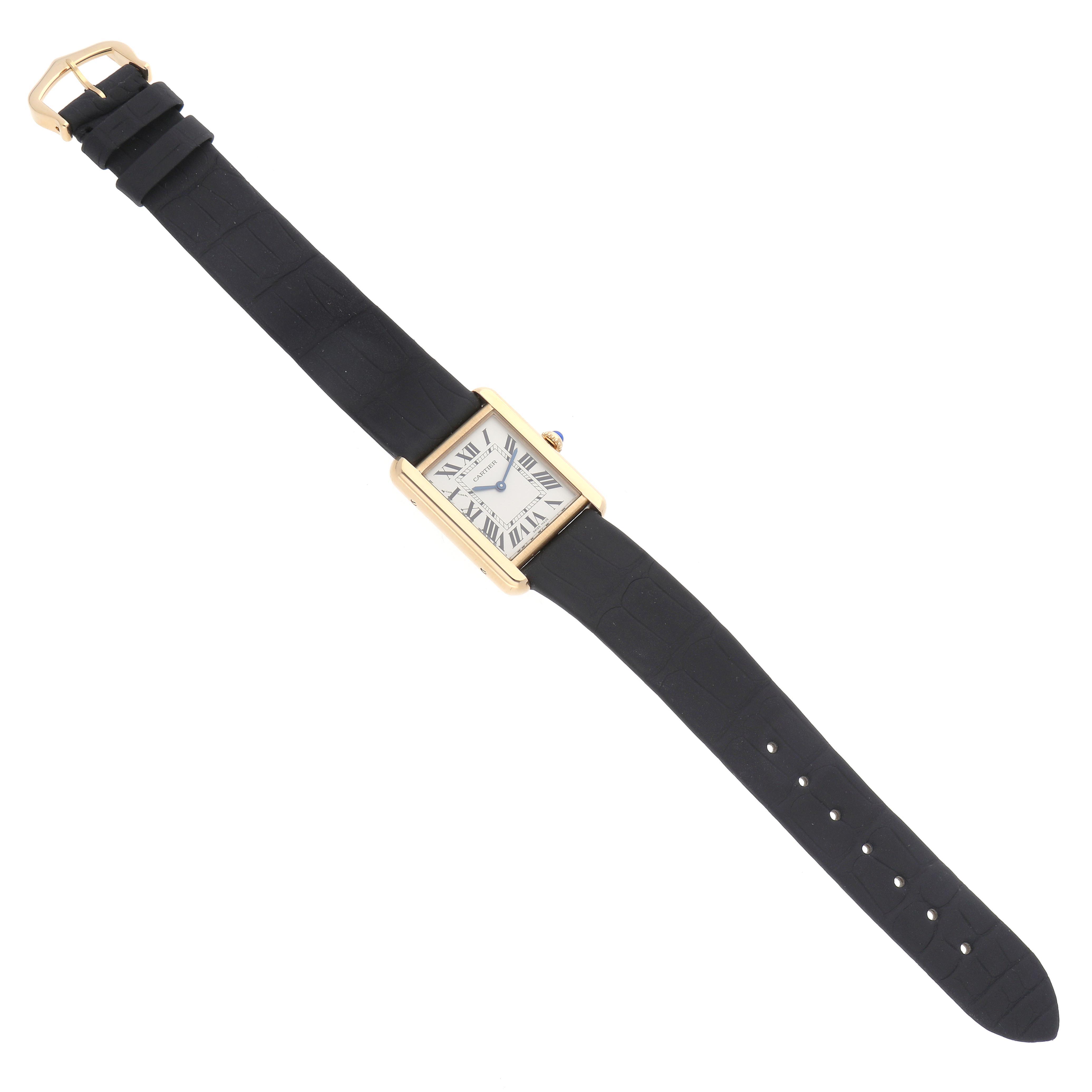 The Cartier Tank Solo W5200002 Women
s Steel and Gold (two tone) Silver Dial W5200002 Women
s Steel and Gold (two tone) Silver Dial watch is shown from a top-down angle, displaying its face, case, strap, and buckle.