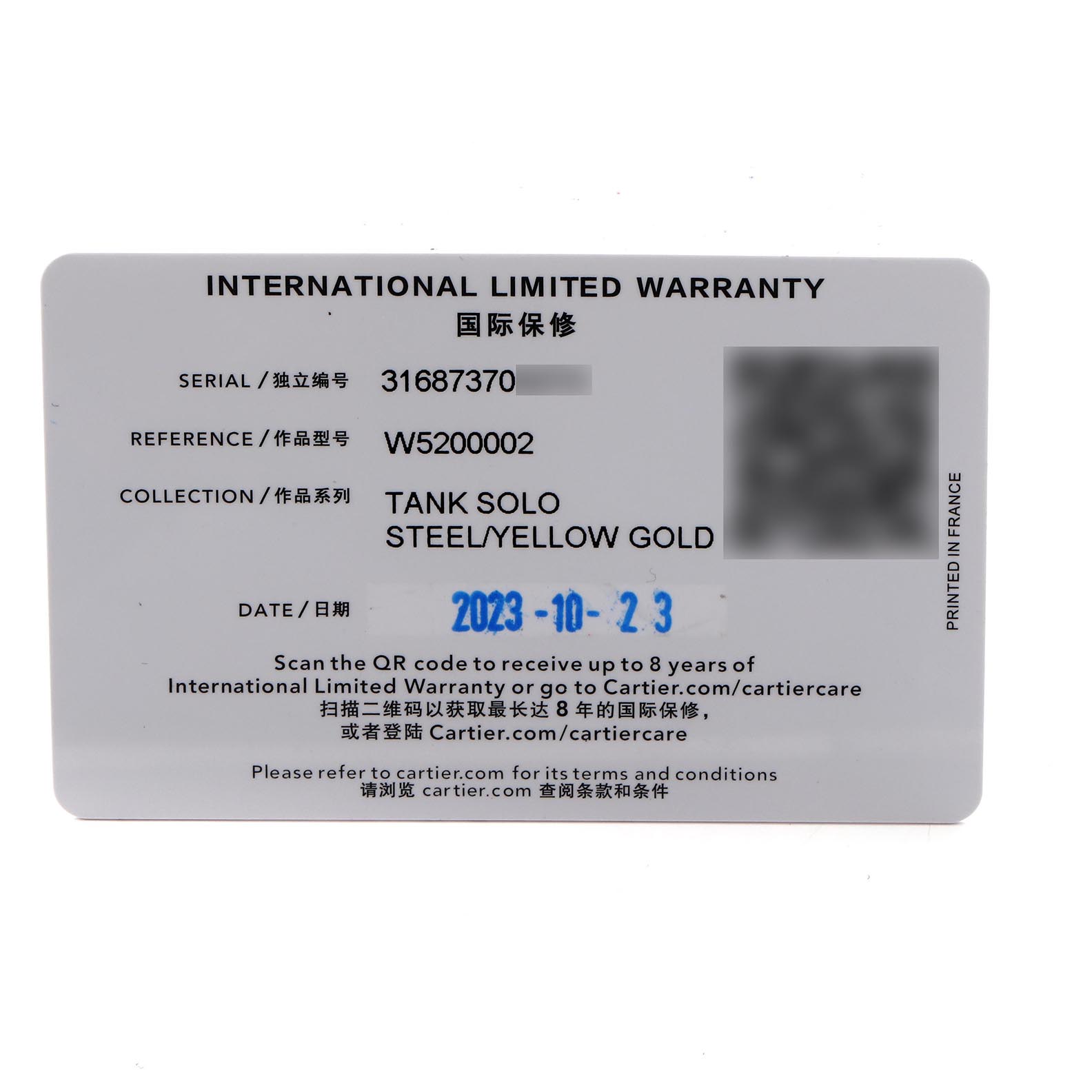The image shows an International Limited Warranty card for the Cartier Tank Solo W5200002 Women
s Steel and Gold (two tone) Silver Dial W5200002 Women
s Steel and Gold (two tone) Silver Dial watch, displaying details like serial and reference numbers.