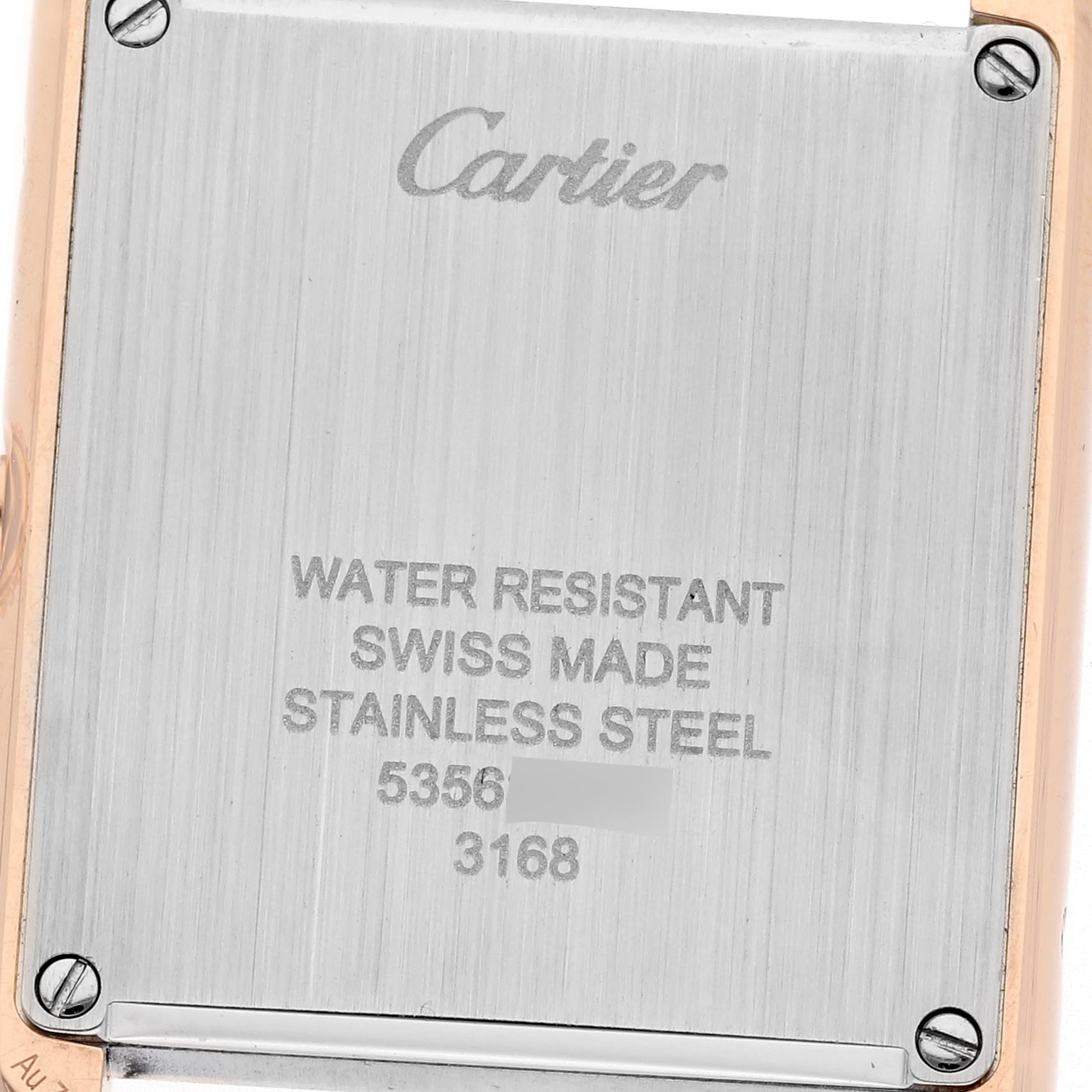 The image shows the back case of a Cartier Tank Solo W5200002 Women
s Steel and Gold (two tone) Silver Dial W5200002 Women
s Steel and Gold (two tone) Silver Dial watch, highlighting its water resistance, stainless steel material, and serial number.