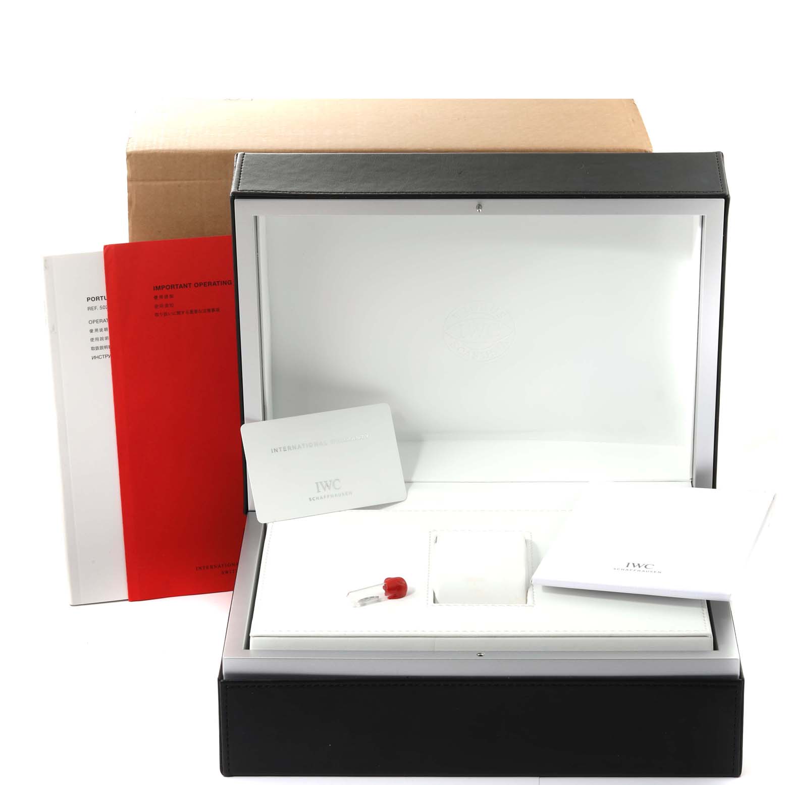 The image shows the packaging, manuals, and accessories for the IWC Portuguese IW502307 Men's White Gold Grey Dial IW502307 Men's White Gold Grey Dial model watch, viewed from the front.