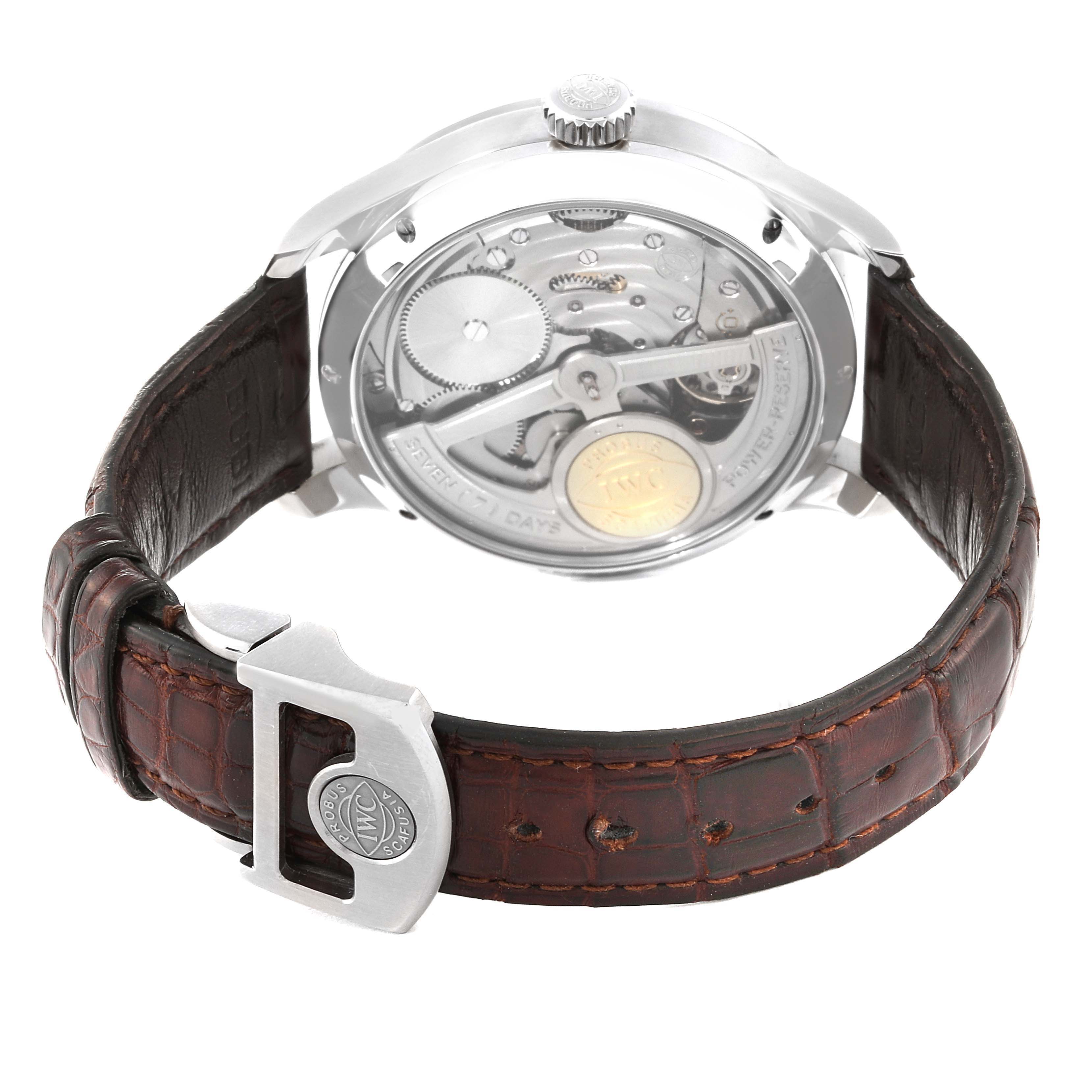 The image shows the back view of an IWC Portuguese IW502307 Men's White Gold Grey Dial IW502307 Men's White Gold Grey Dial watch with its movement and leather strap visible.