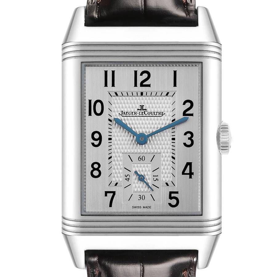 The Jaeger LeCoultre Reverso watch is shown from a front angle, highlighting the dial and crown.