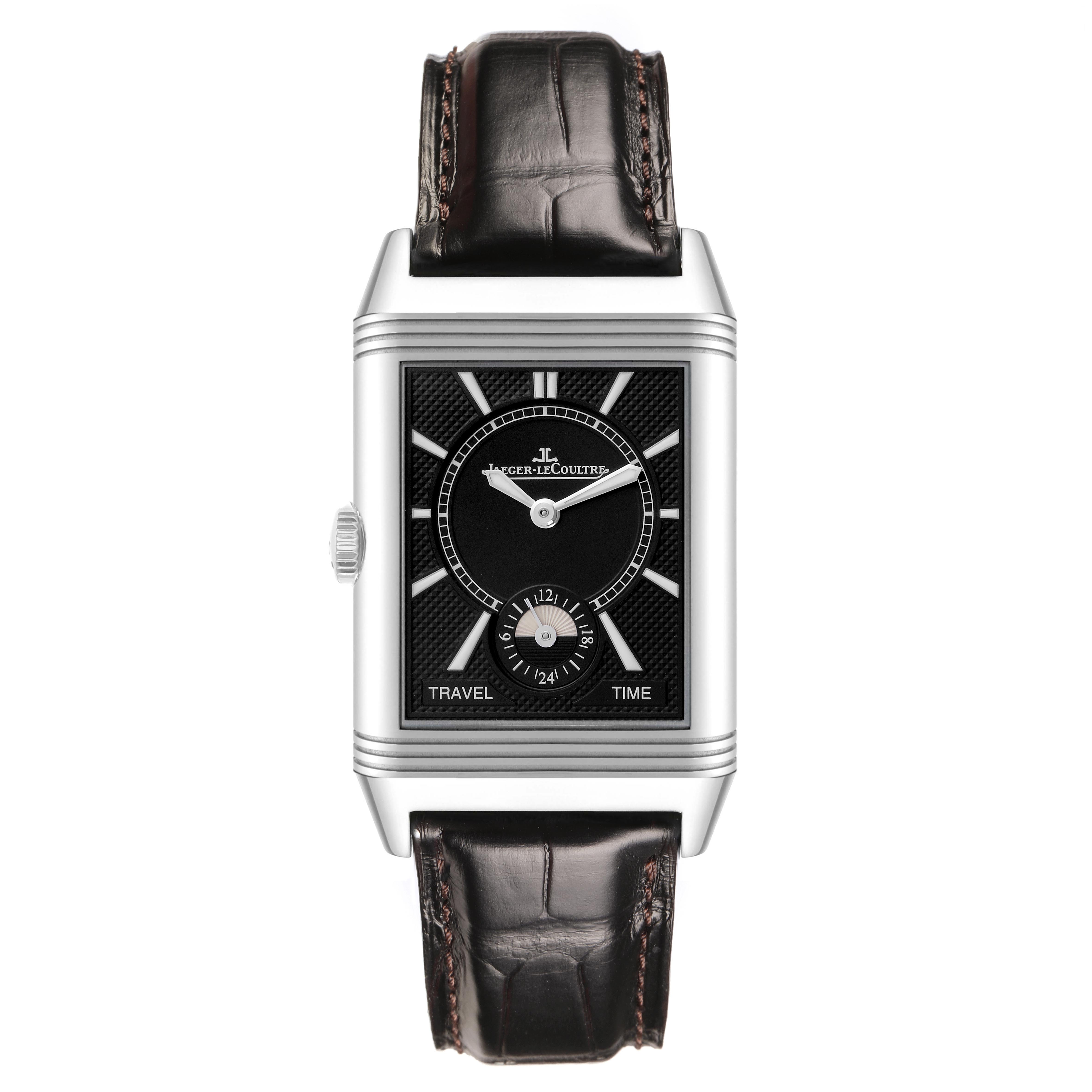The image shows a Jaeger LeCoultre Reverso Q3848420 Men
s Stainless Steel Silver Dial Q3848420 Men
s Stainless Steel Silver Dial watch from a front angle, highlighting its rectangular face, leather strap, and travel time feature.