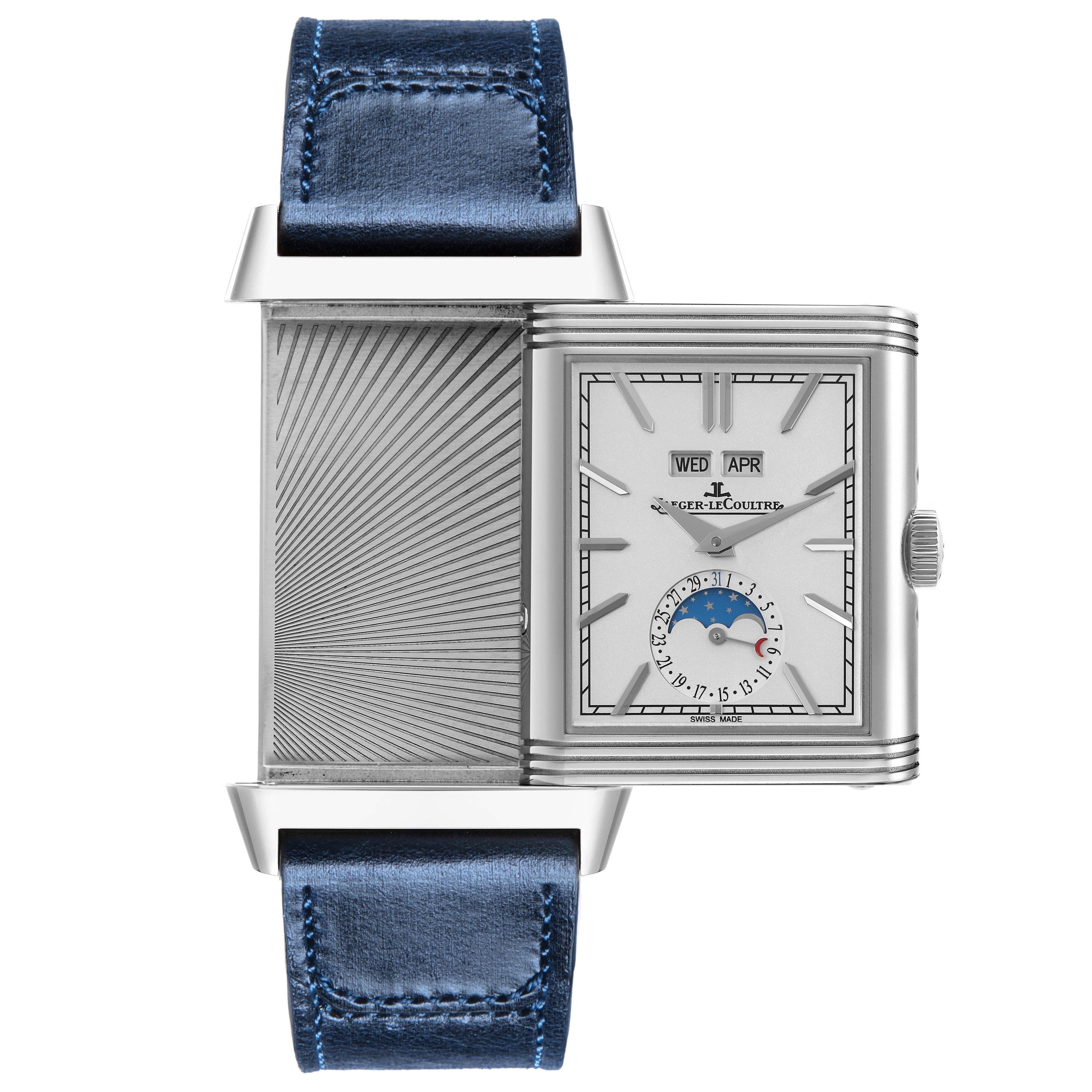 The Jaeger-LeCoultre Reverso watch is shown sideways with its reversible case open, displaying both the dial and the back.