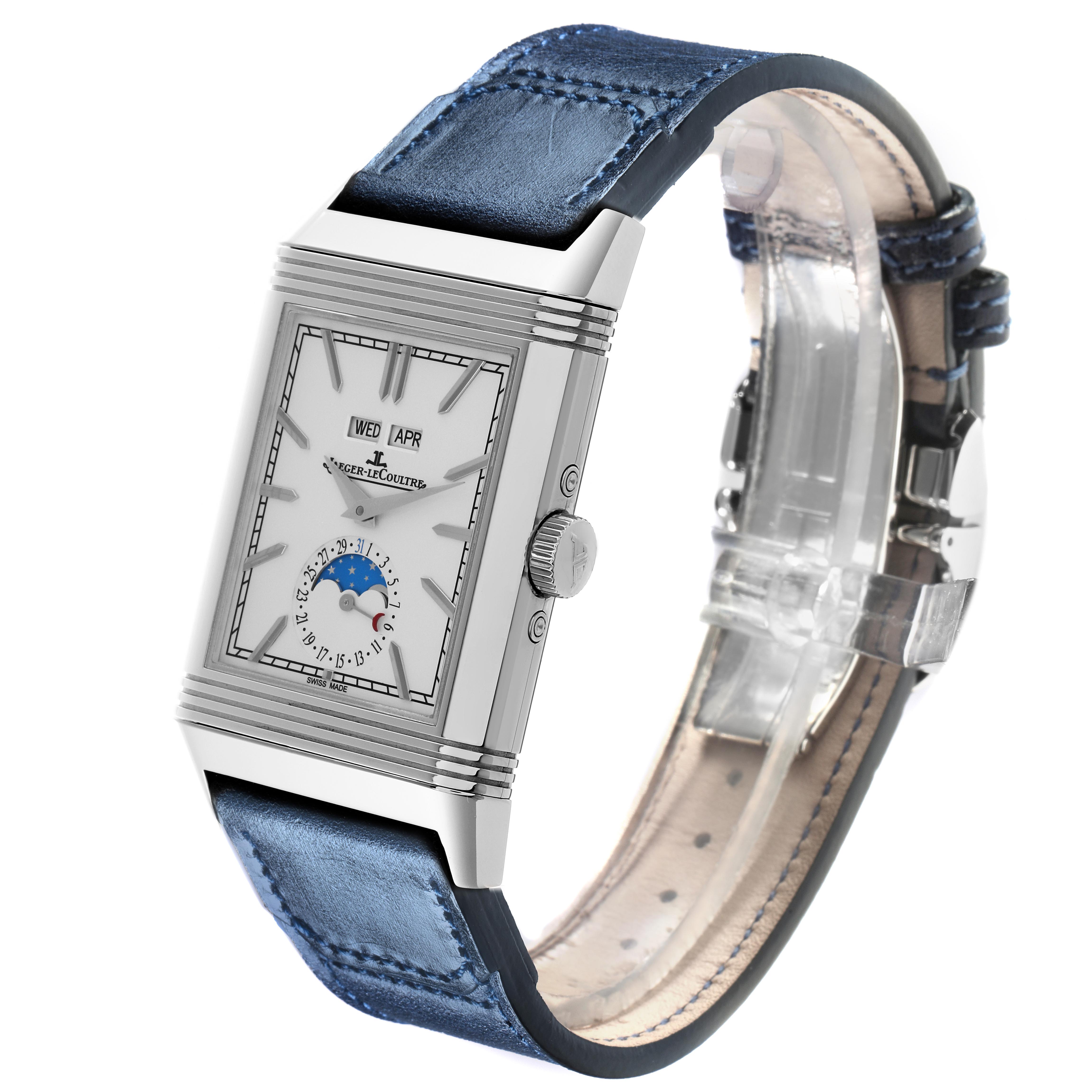 The image shows a side angle of the Jaeger-LeCoultre Reverso watch, highlighting its case, dial, crown, and blue leather strap.