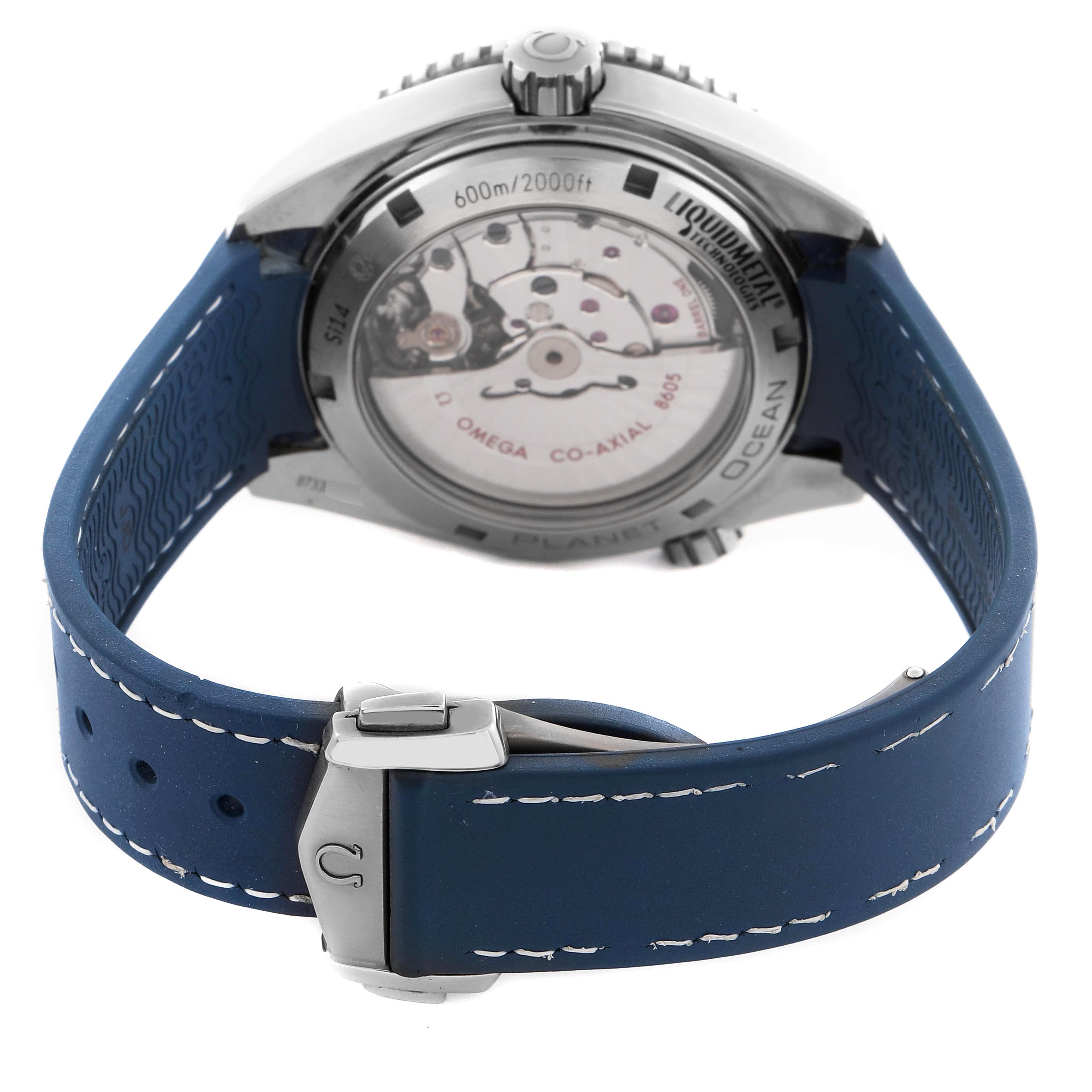 The Omega Planet Ocean 232.92.44.22.03.001 Men
s Stainless Steel Blue Dial 232.92.44.22.03.001 Men
s Stainless Steel Blue Dial watch is shown from a rear angle, highlighting its transparent case back and blue strap with a clasp.