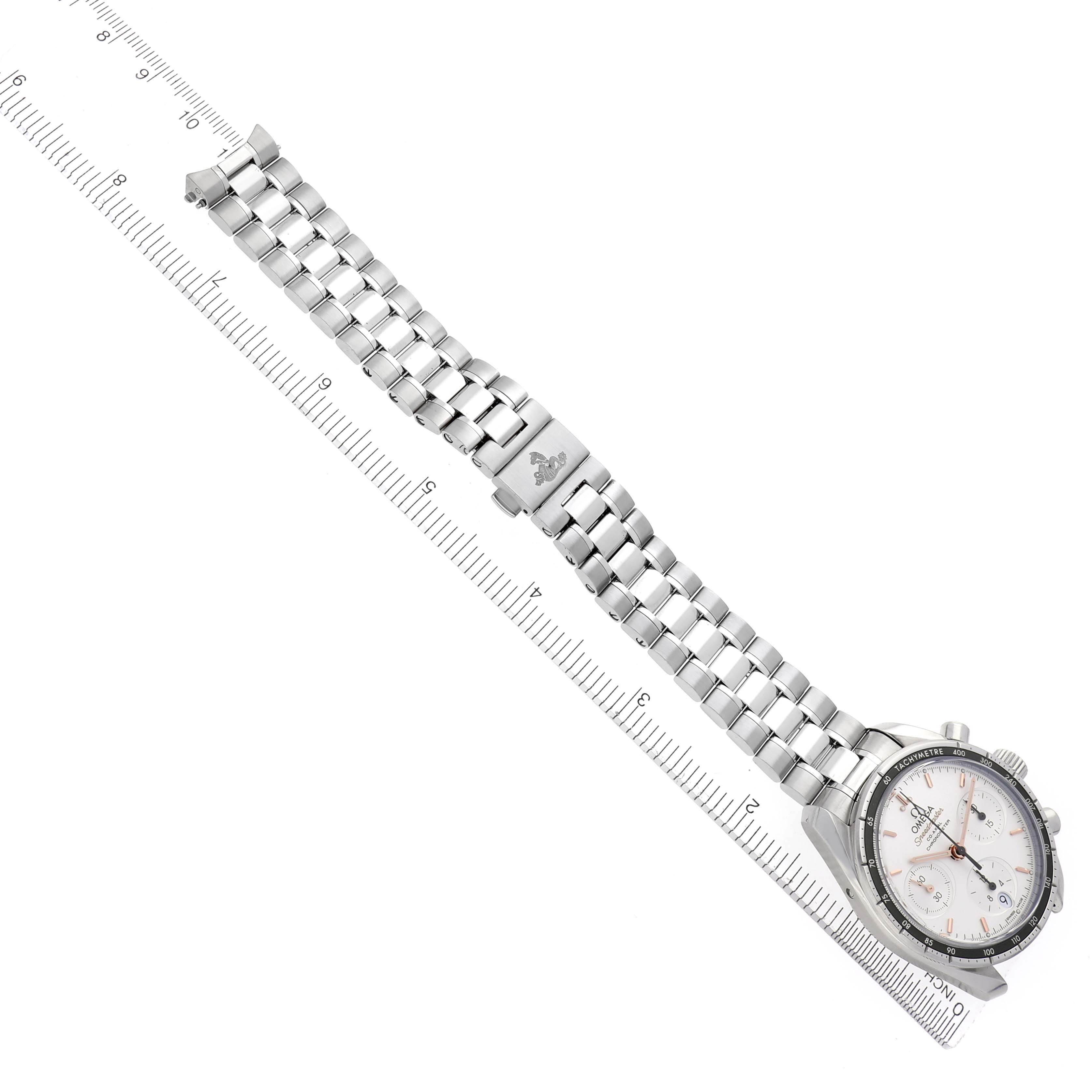 The Omega Speedmaster 324.30.38.50.02.001 Men
s Stainless Steel Silver Dial 324.30.38.50.02.001 Men
s Stainless Steel Silver Dial watch is shown at an angle, displaying the full bracelet and clasp alongside a ruler for scale.