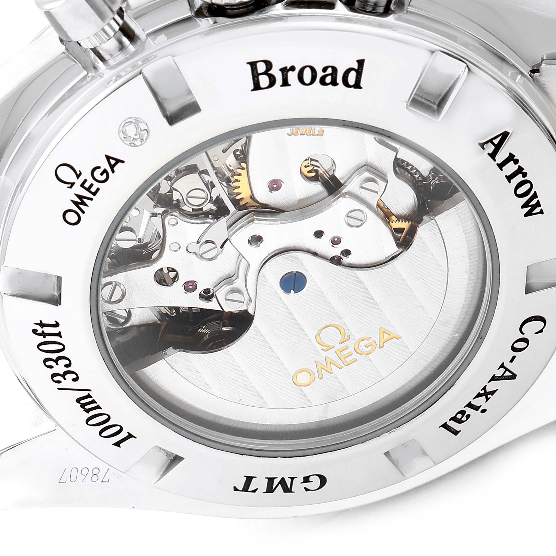 The image shows the back view of an Omega Speedmaster 3581.30.00 Men's Stainless Steel Black Dial 3581.30.00 Men's Stainless Steel Black Dial watch, revealing the internal mechanics and various brand engravings.