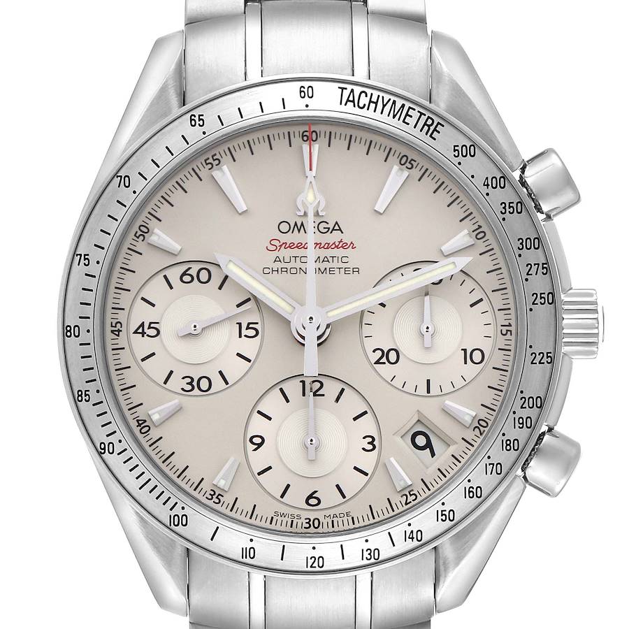 The Omega Speedmaster watch is shown from the front, displaying the dial, tachymeter bezel, and side pushers.