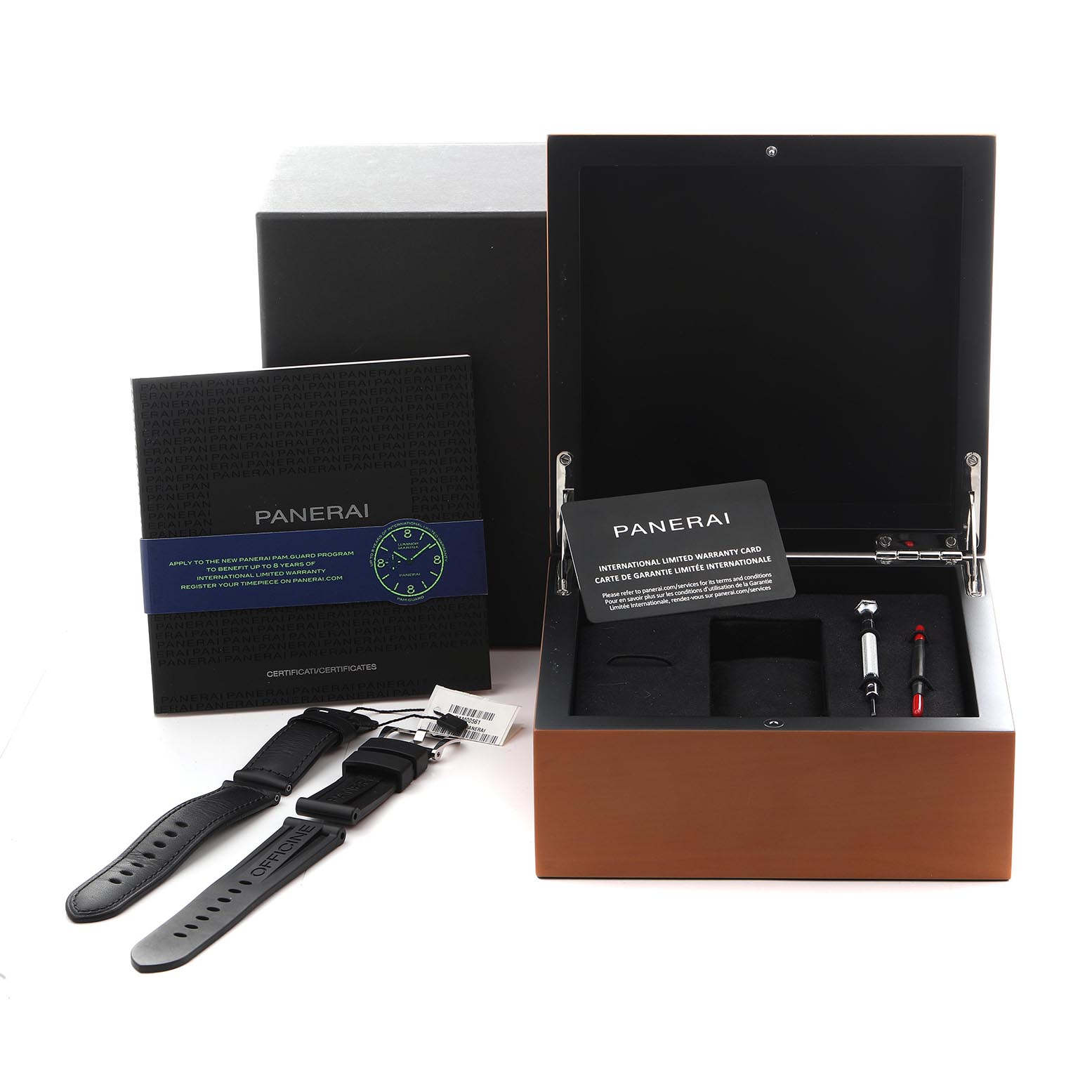 The image shows a Panerai Luminor PAM00561 Men
s Stainless Steel White Dial PAM00561 Men
s Stainless Steel White Dial watch box, additional straps, warranty card, and tools from a top-down angle.