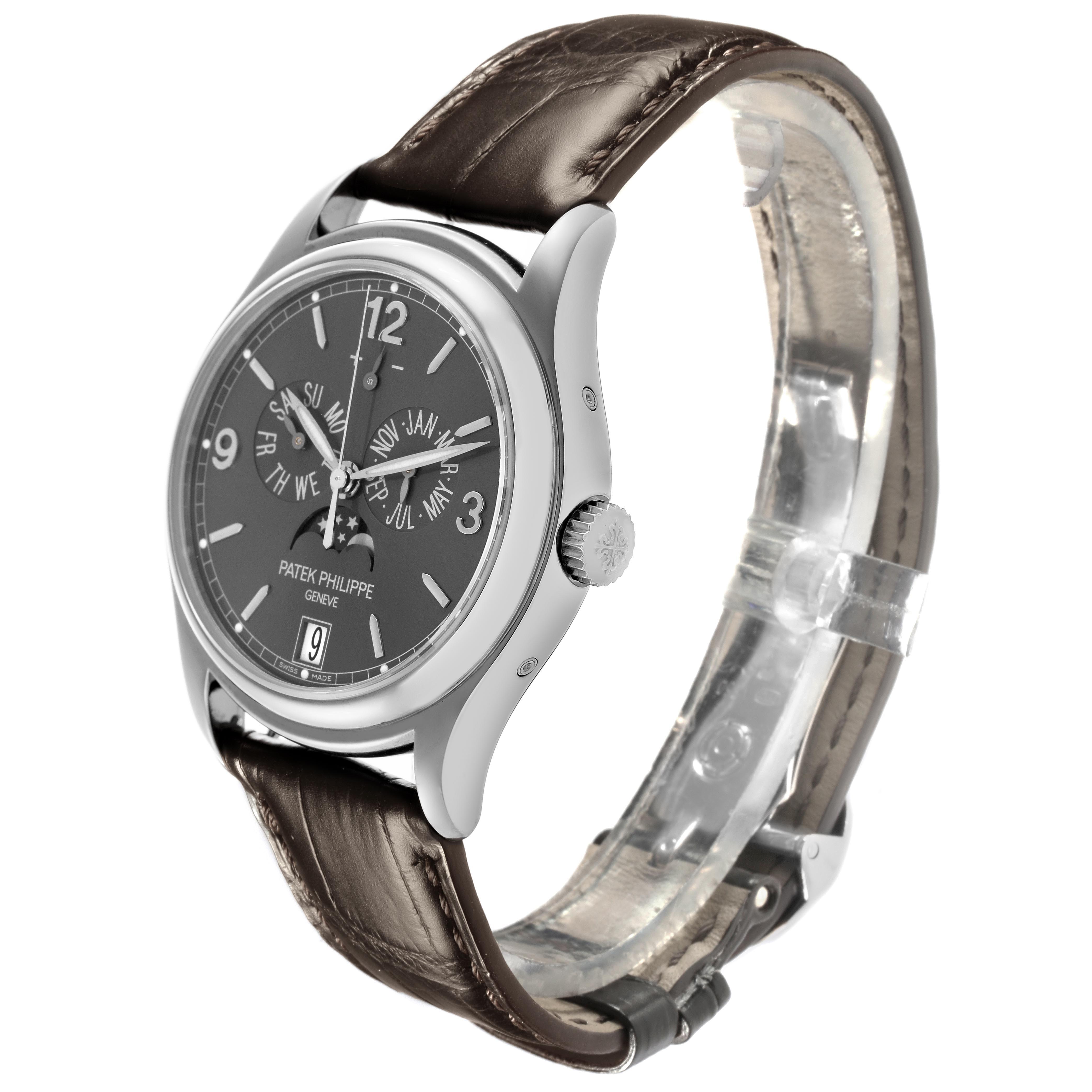 The Patek Philippe Complications 5146G-010 Men
s White Gold Grey Dial 5146G-010 Men
s White Gold Grey Dial watch is shown at a three-quarter angle, displaying the dial, case, crown, and leather strap.