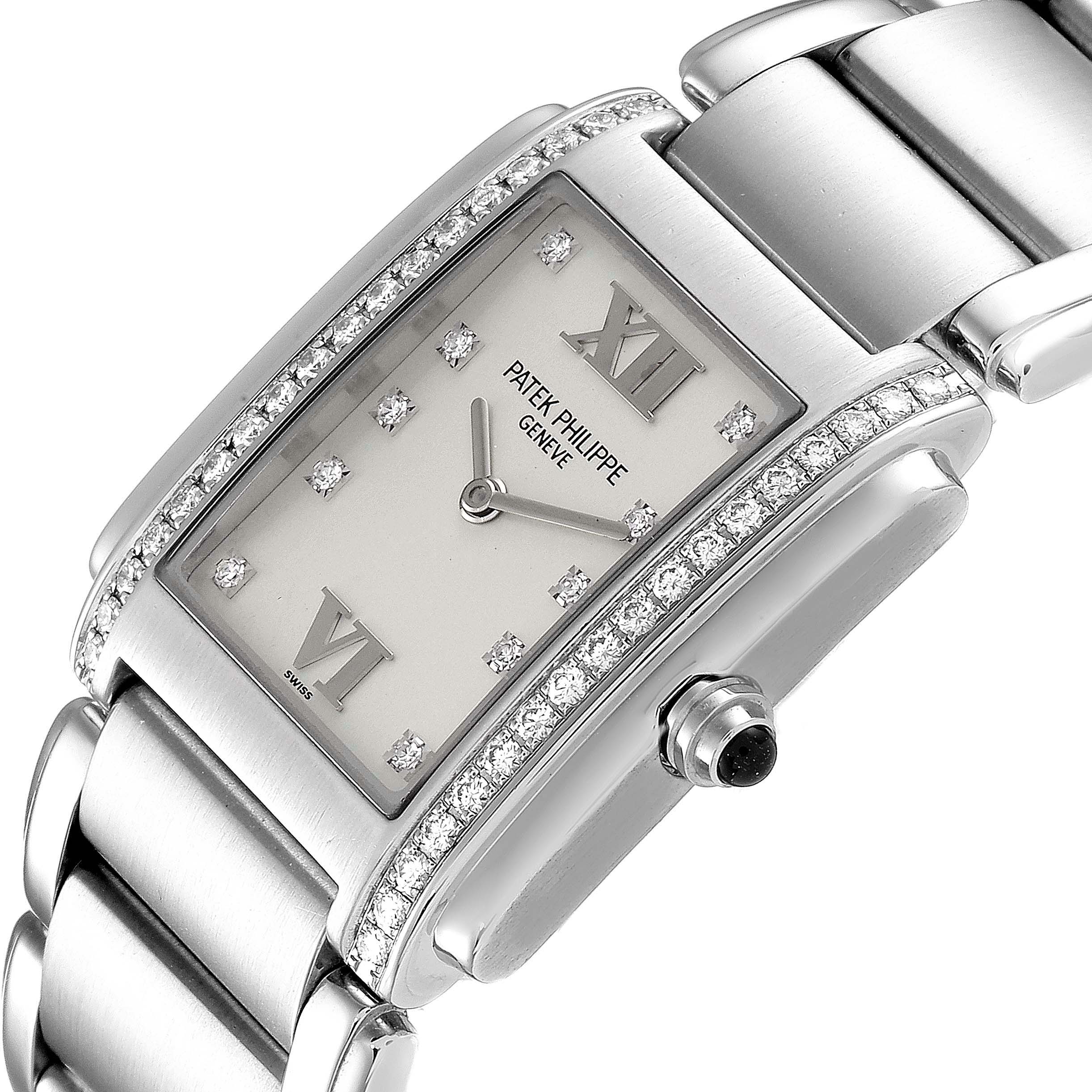 The image shows a Patek Philippe Twenty-4 4910/10A-010 Women's Stainless Steel Silver Dial 4910/10A-010 Women's Stainless Steel Silver Dial model watch from an angled view, focusing on the dial, crown, and part of the bracelet.