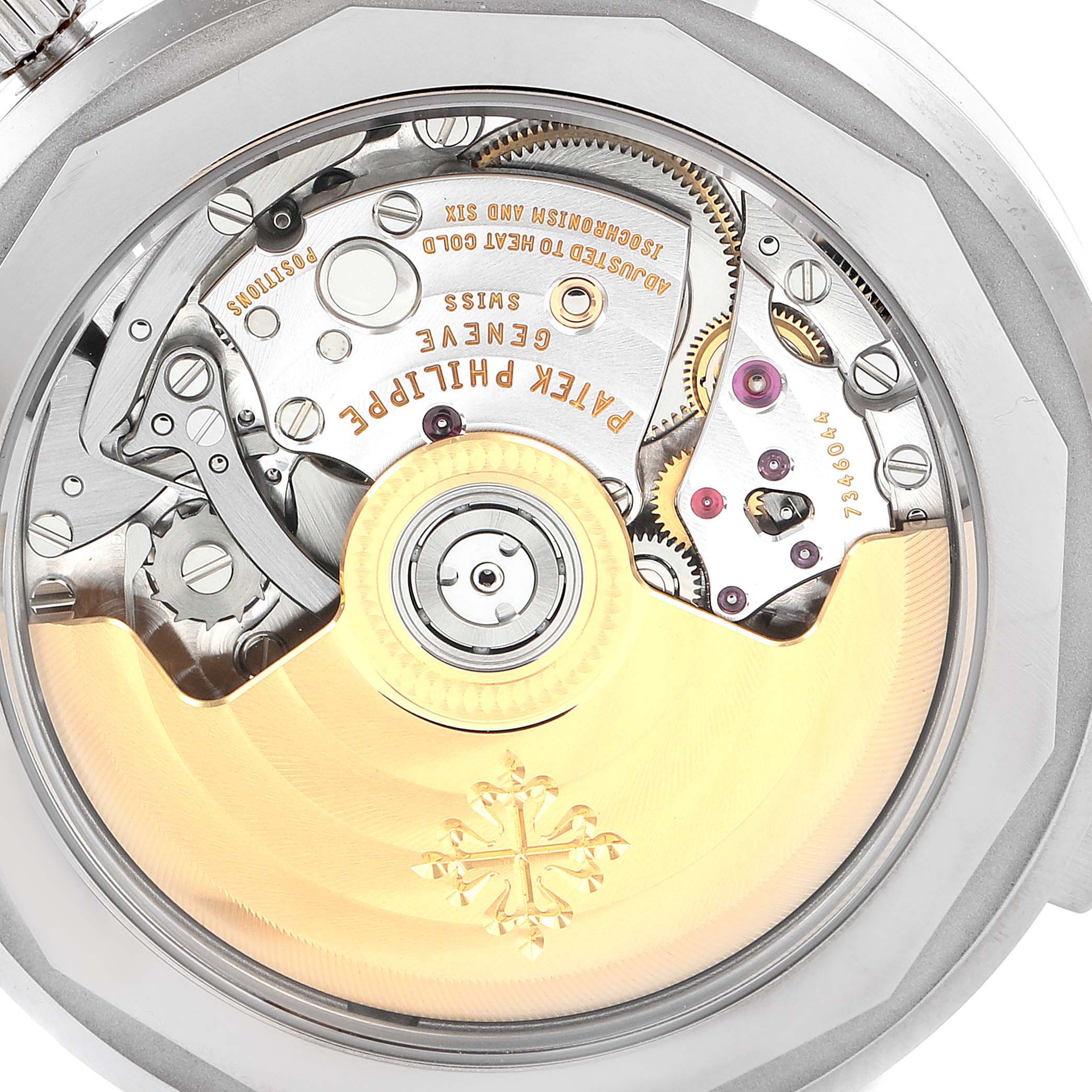 The image shows the intricate movement and rotor of the Patek Philippe Complications 5930G-001 Men
s White Gold Blue Dial 5930G-001 Men
s White Gold Blue Dial model from a back angle.