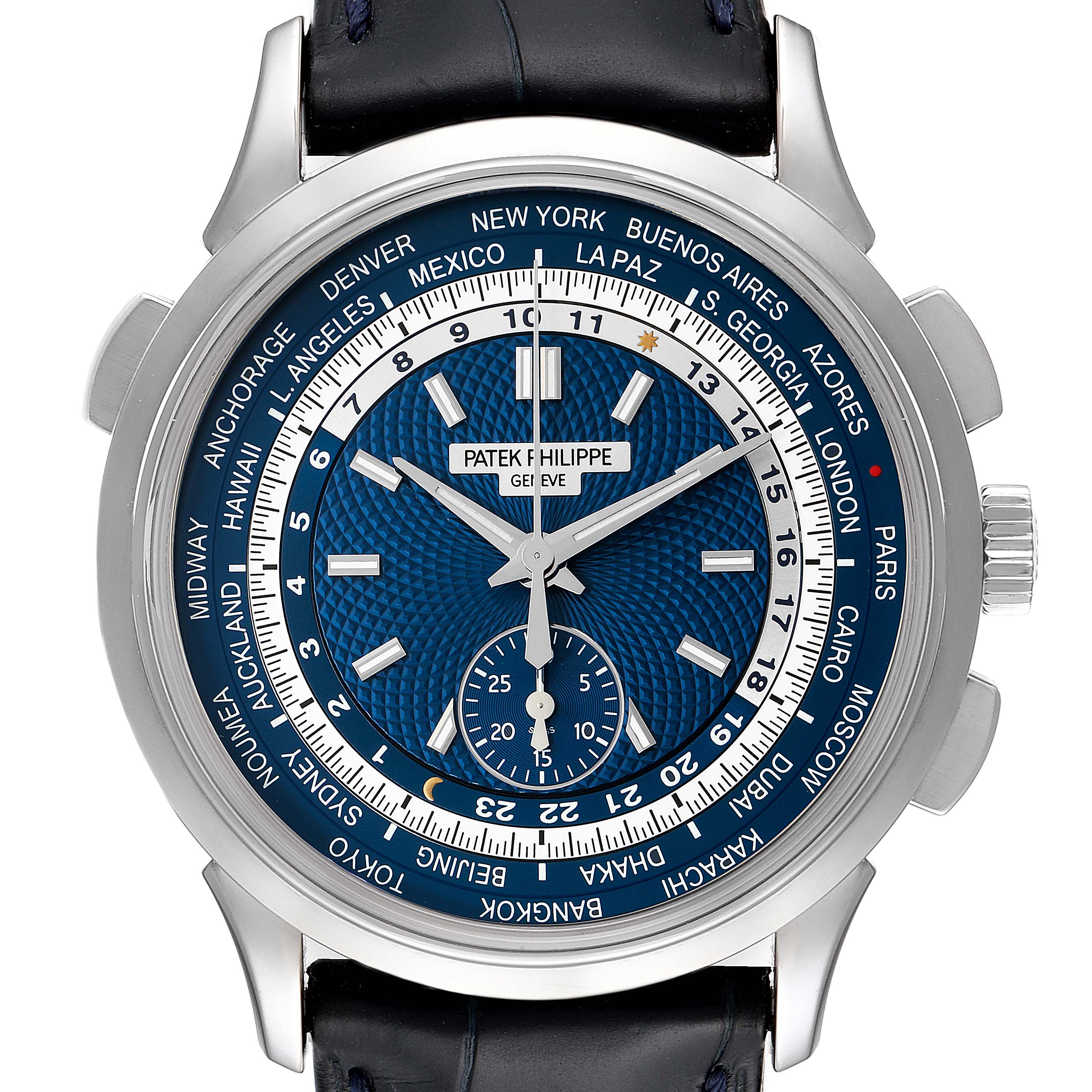 The image shows the face of a Patek Philippe Complications 5930G-001 Men
s White Gold Blue Dial 5930G-001 Men
s White Gold Blue Dial watch, highlighting the world time display and the blue dial.