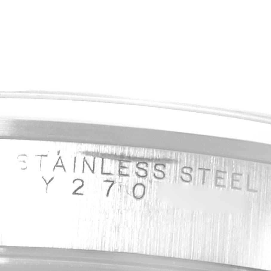 The image shows a close-up of the side of the bezel with "STAINLESS STEEL" engraved on the Rolex Air-King 14000 Men's Stainless Steel Black Dial 14000 Men's Stainless Steel Black Dial model watch.
