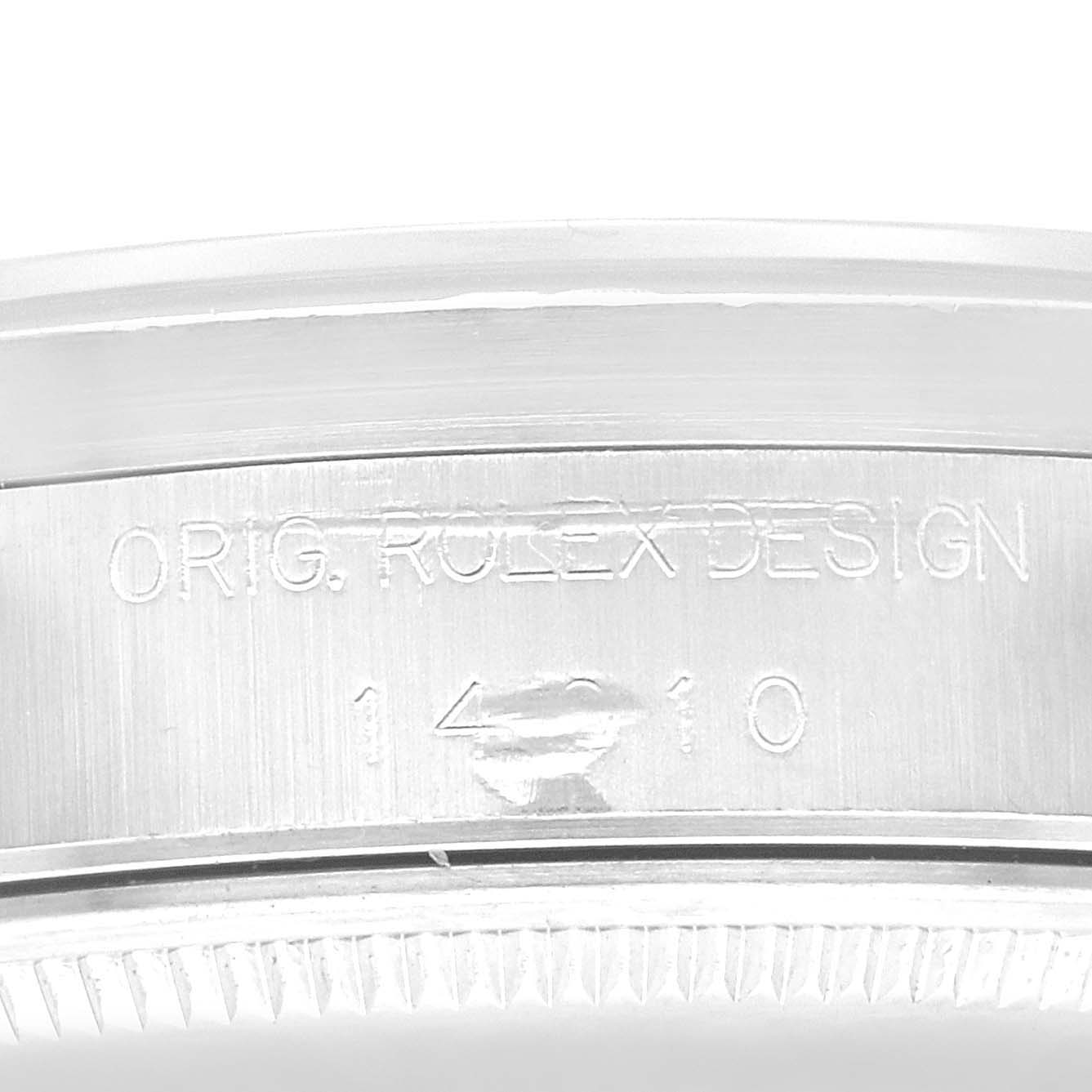 The image shows a close-up of the side of a Rolex Air-King 14010 Men's Stainless Steel Black Dial 14010 Men's Stainless Steel Black Dial watch, showcasing the engraved model number and design details.