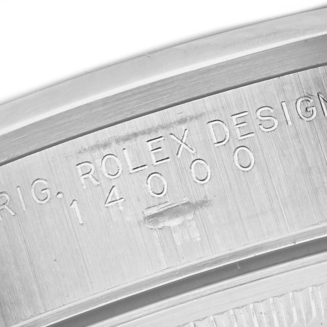 Close-up of the engraved case back of a Rolex Air-King 14000 Men's Stainless Steel Silver Dial 14000 Men's Stainless Steel Silver Dial watch, showing the model number and "Rolex Design" text.
