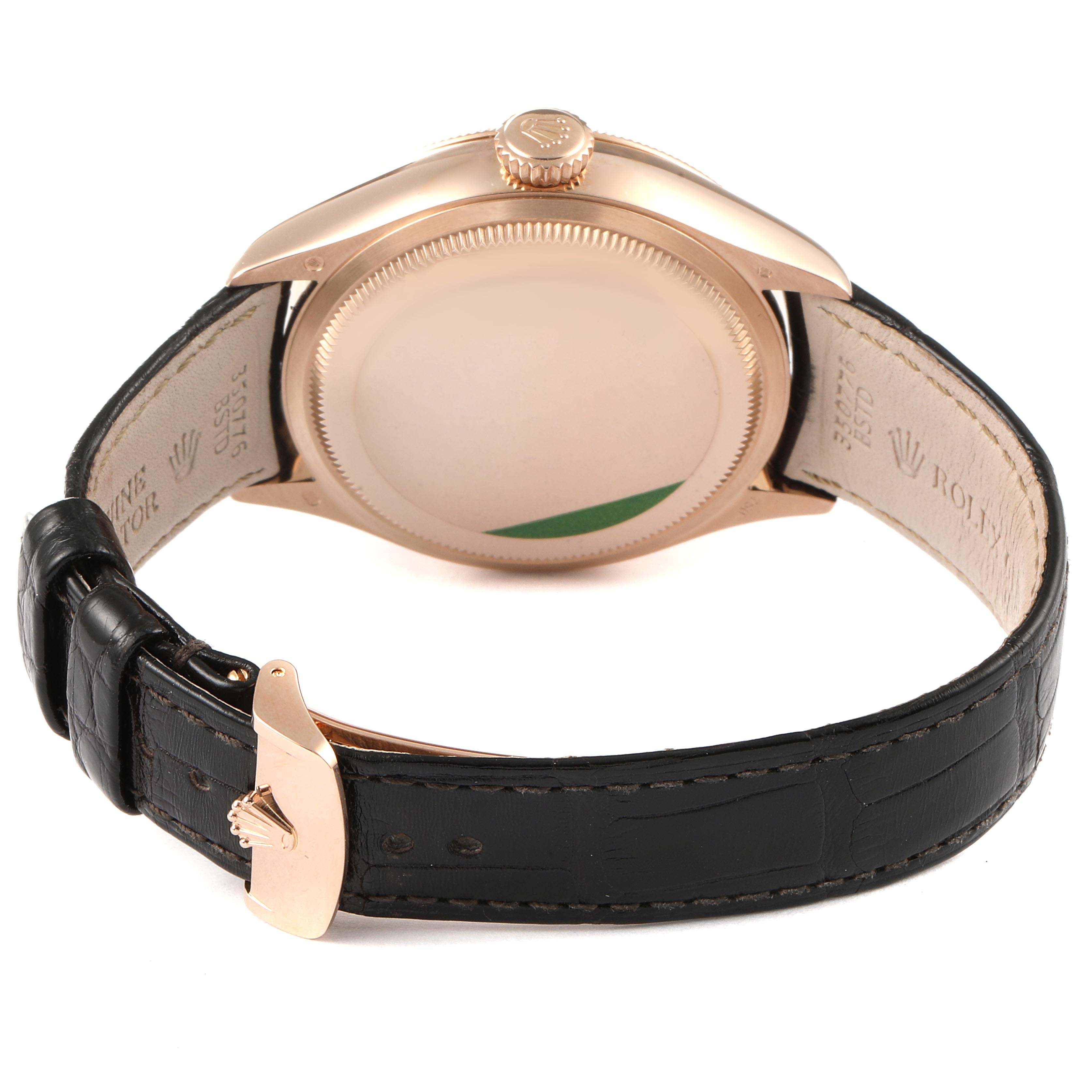 The image shows the back and side view of a Rolex Cellini 50535 Men
s Rose Gold White Dial 50535 Men
s Rose Gold White Dial watch with its leather strap and clasp.