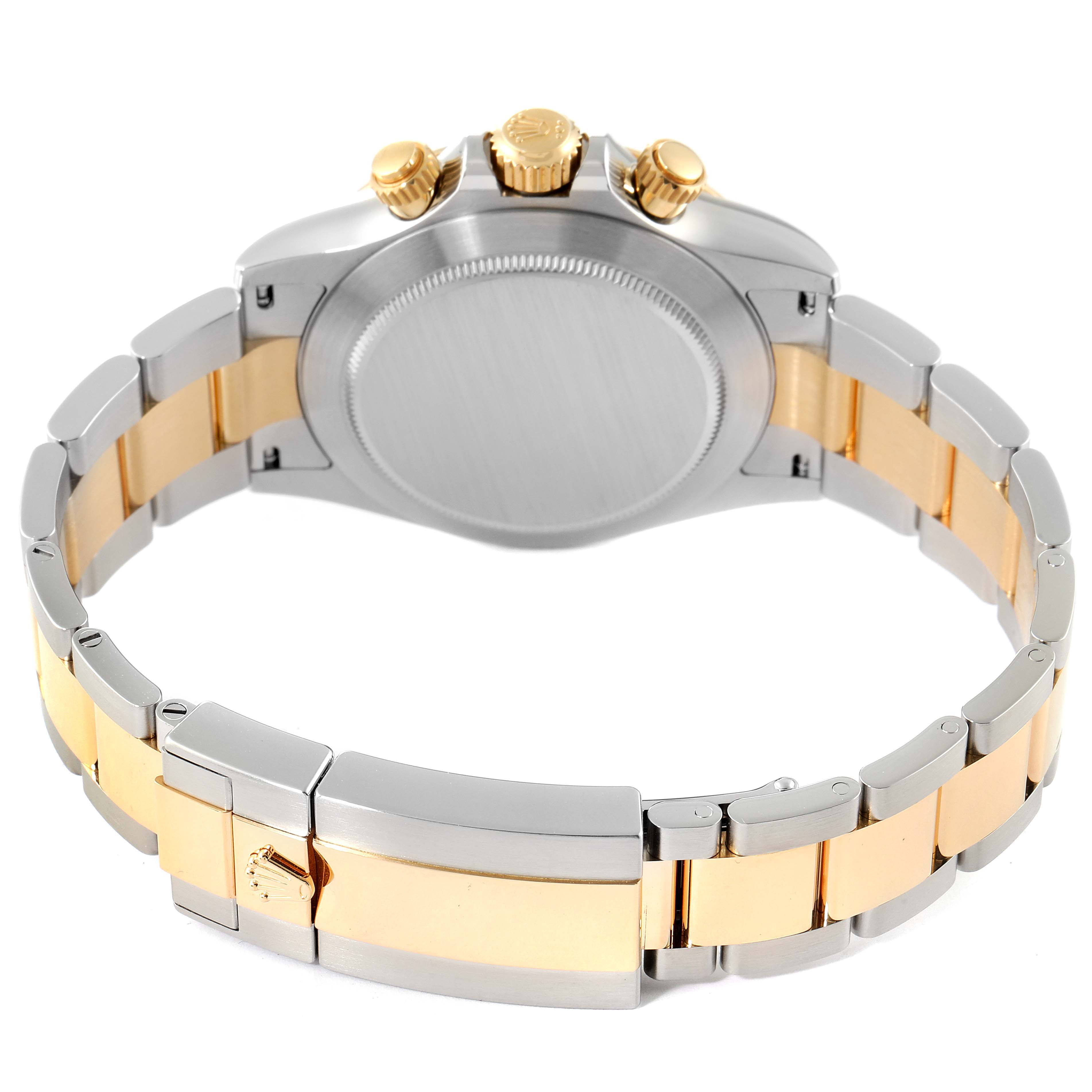 The image shows the back view of a Rolex Daytona 116503 Men's Steel and Gold (two tone) Champagne Dial 116503 Men's Steel and Gold (two tone) Champagne Dial watch, highlighting the clasp, case back, and part of the bracelet.