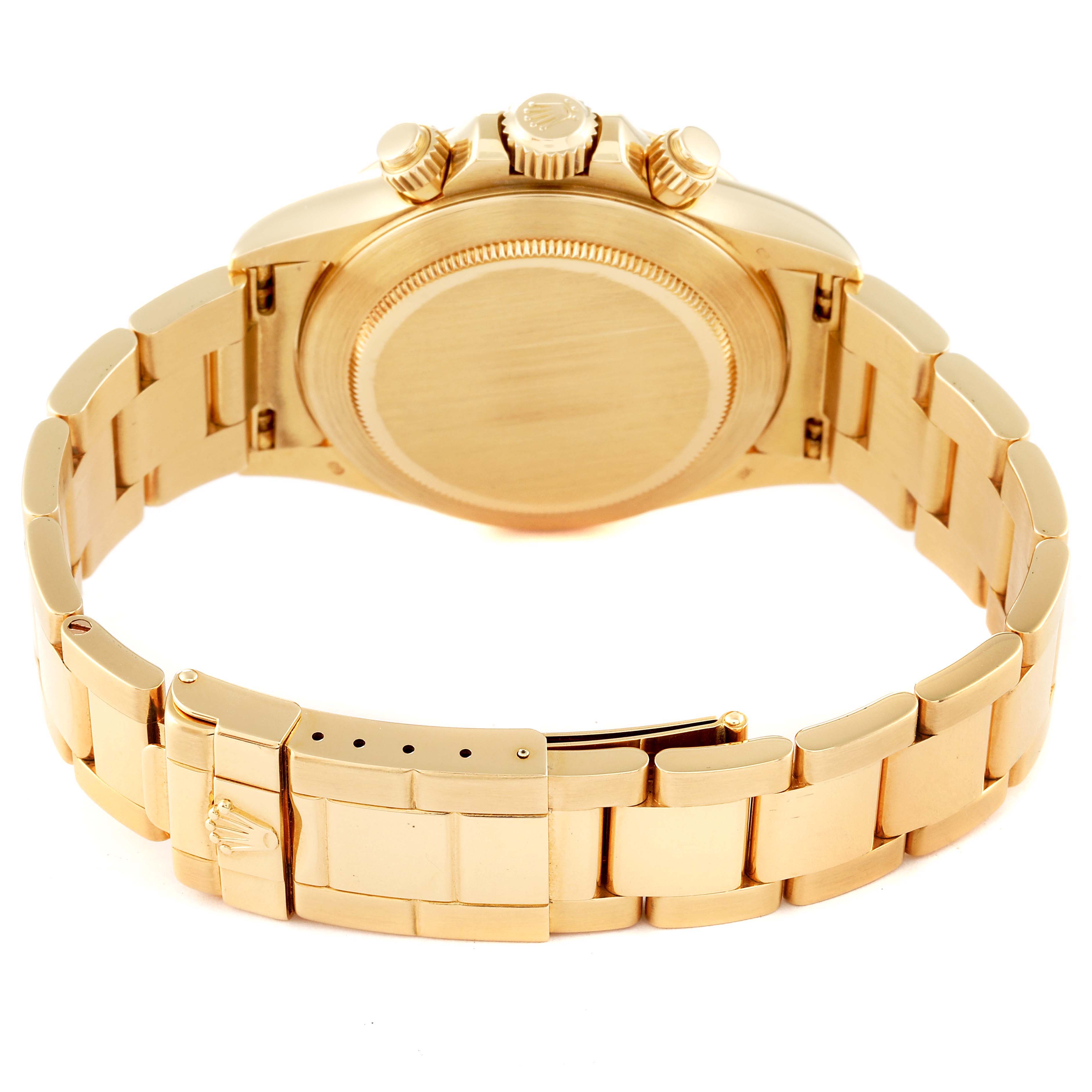 The Rolex Daytona 16528 Men's Yellow Gold Black Dial 16528 Men's Yellow Gold Black Dial watch is shown from the rear, highlighting the case back, bracelet, and clasp.