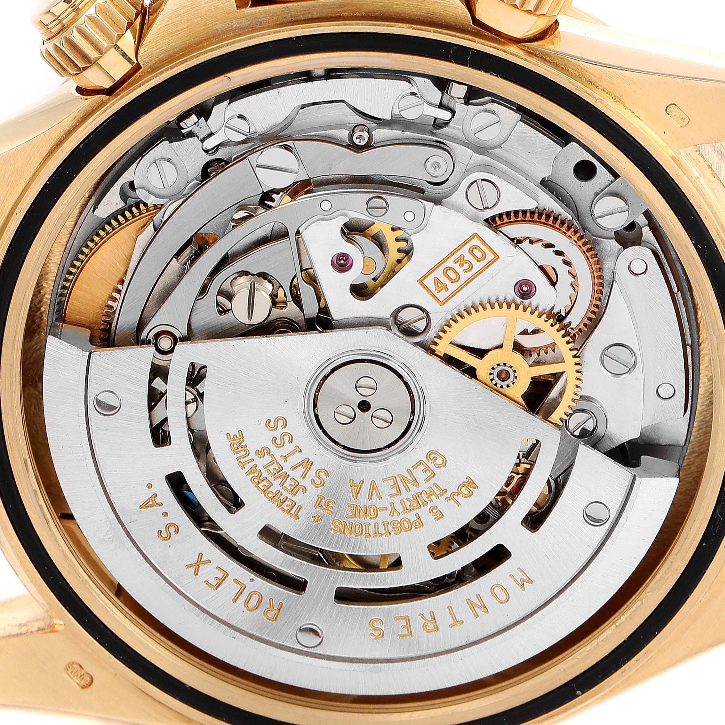 This image shows a close-up of the movement mechanism of a Rolex Daytona 16528 Men's Yellow Gold Black Dial 16528 Men's Yellow Gold Black Dial watch, highlighting its intricate internal components.