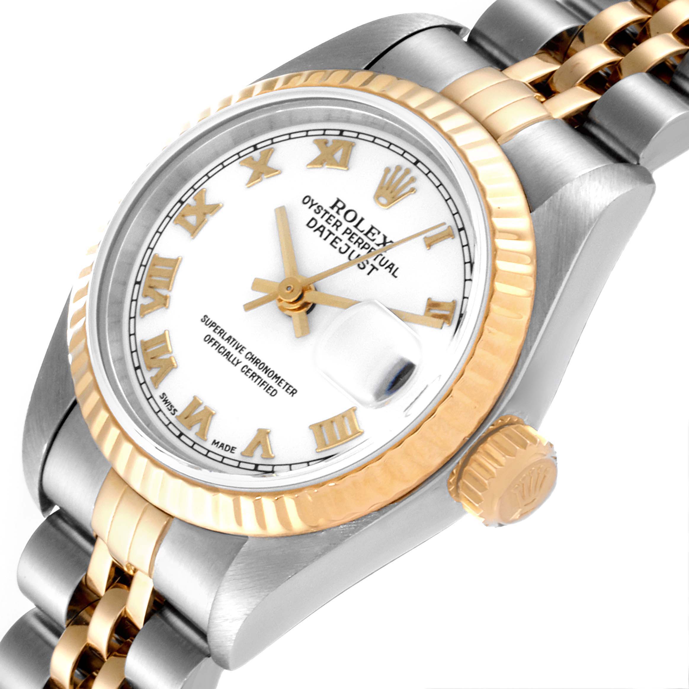 The image shows a close-up, angled view of the Rolex Datejust 79173 Women's Steel and Gold (two tone) White Dial 79173 Women's Steel and Gold (two tone) White Dial model, highlighting its bezel, crown, and face.