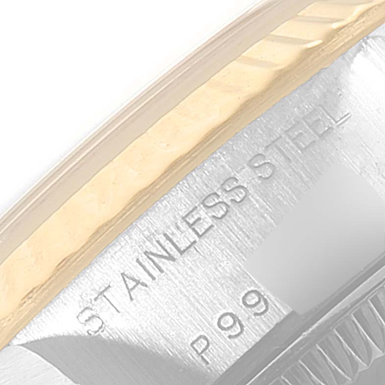 The image shows a close-up angled shot of the rim and part of the case back of the Rolex Datejust 79173 Women's Steel and Gold (two tone) White Dial 79173 Women's Steel and Gold (two tone) White Dial watch, highlighting "STAINLESS STEEL" engraving.