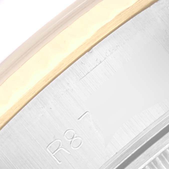 The image shows a close-up of the outer edge and part of the bezel of a Rolex Datejust 69173 Women's Steel and Gold (two tone) Black Dial 69173 Women's Steel and Gold (two tone) Black Dial watch.