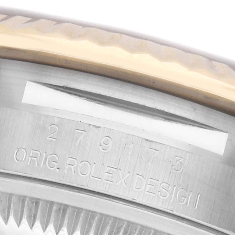 The image shows a close-up of a Rolex Datejust model's case, focusing on the engraved serial number and "Orig. Rolex Design."