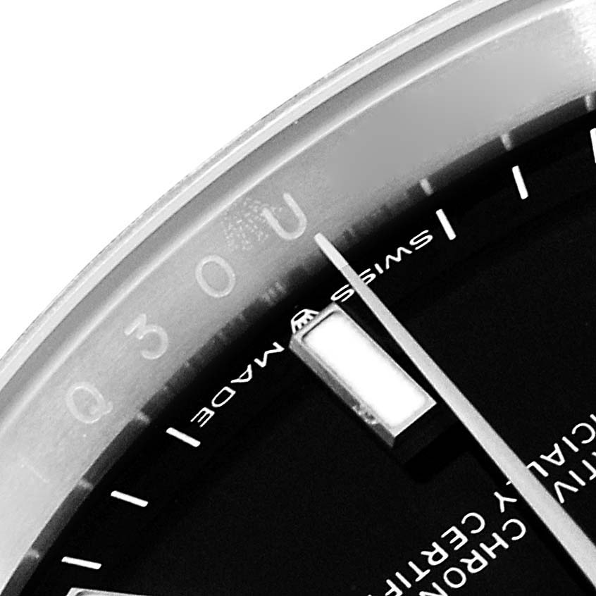 A macro shot showing the upper right portion of the dial and hands of the Rolex Datejust 126200 Men
s Stainless Steel Black Dial 126200 Men
s Stainless Steel Black Dial watch.