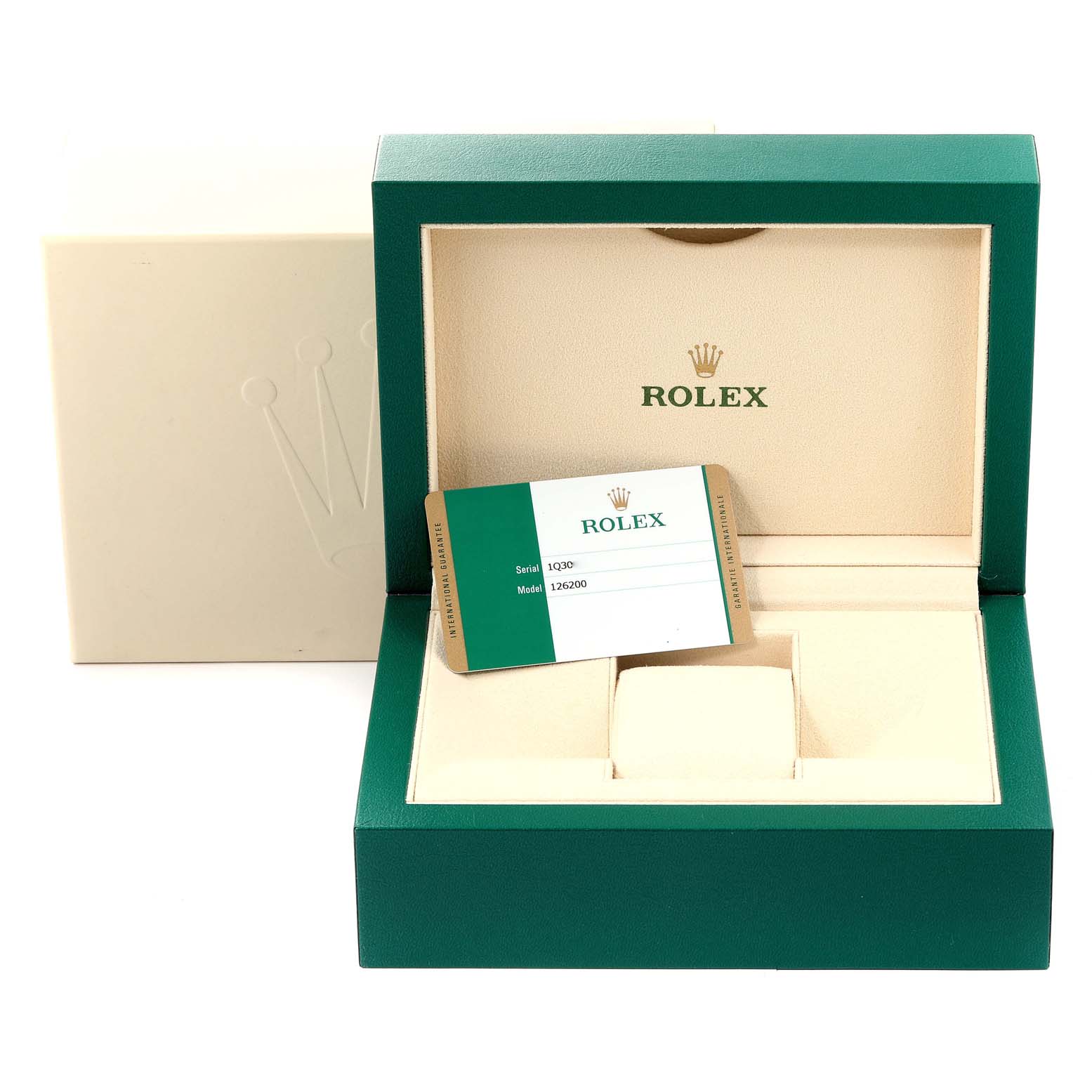 This image shows an open Rolex Datejust 126200 Men
s Stainless Steel Black Dial 126200 Men
s Stainless Steel Black Dial watch box with its warranty card displayed inside.