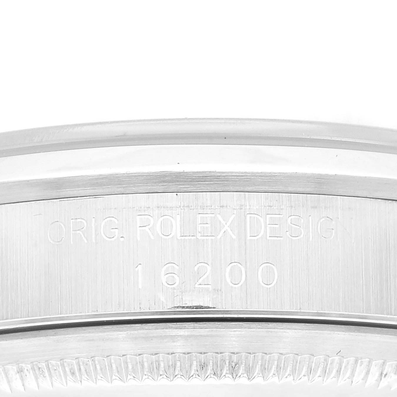 This is a close-up view of the case side of a Rolex Datejust 16200 Men's Stainless Steel Black Dial 16200 Men's Stainless Steel Black Dial model, showing the model number 16200 engraving.