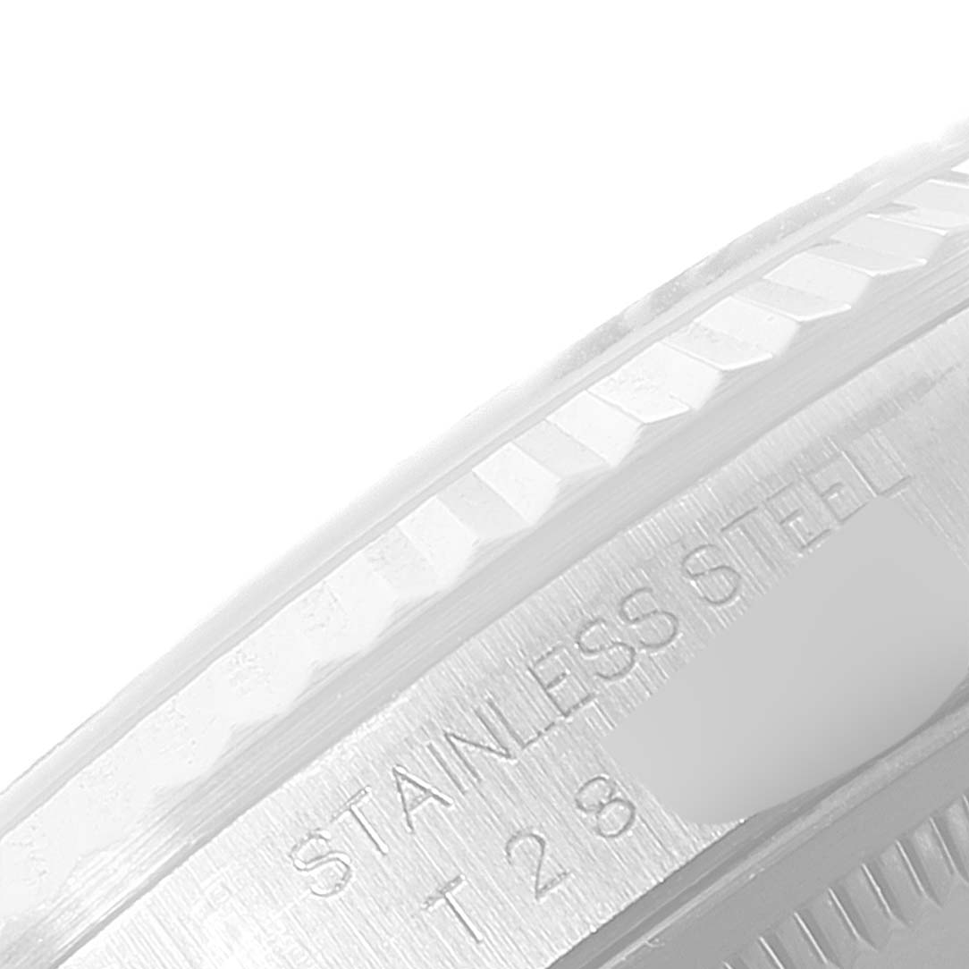 This image shows a close-up of the side bezel and case of a Rolex Datejust 16234 Men's Stainless Steel Blue Dial 16234 Men's Stainless Steel Blue Dial, including stainless steel engraving.