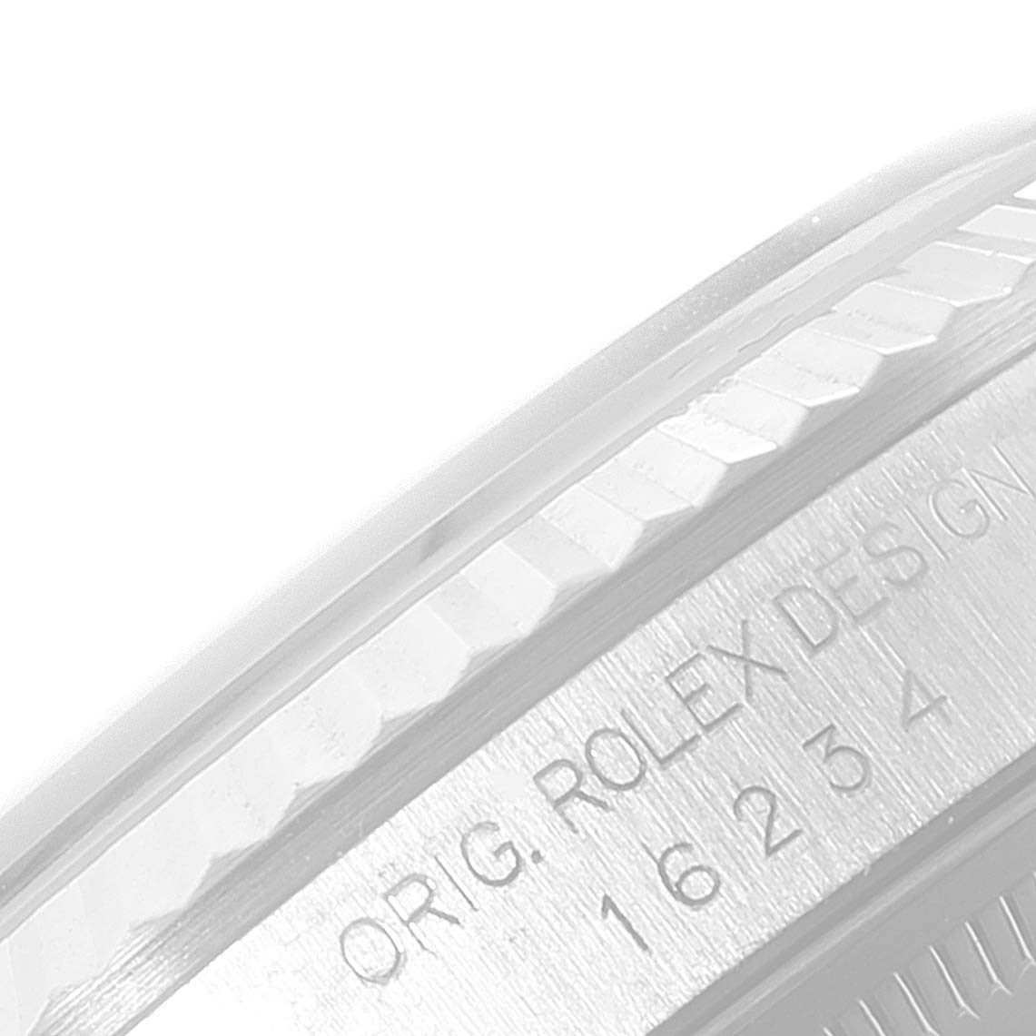 This image shows a close-up of the bezel and part of the case side of a Rolex Datejust 16234 Men's Stainless Steel Blue Dial 16234 Men's Stainless Steel Blue Dial watch, along with its engraved design numbers.