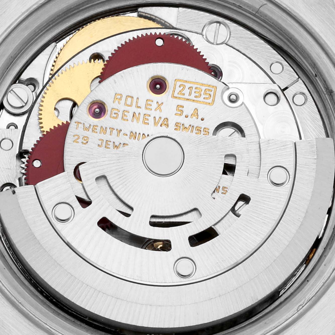 The image shows the movement mechanism of a Rolex Datejust 69173 Women's Steel and Gold (two tone) Champagne Dial 69173 Women's Steel and Gold (two tone) Champagne Dial watch, including gears and engraved details.