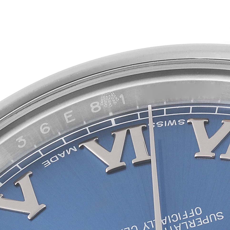 This image shows a close-up of the upper left quadrant of a Rolex Datejust 41 116300 Men's Stainless Steel Blue Dial 116300 Men's Stainless Steel Blue Dial watch face with a blue dial and Roman numerals.