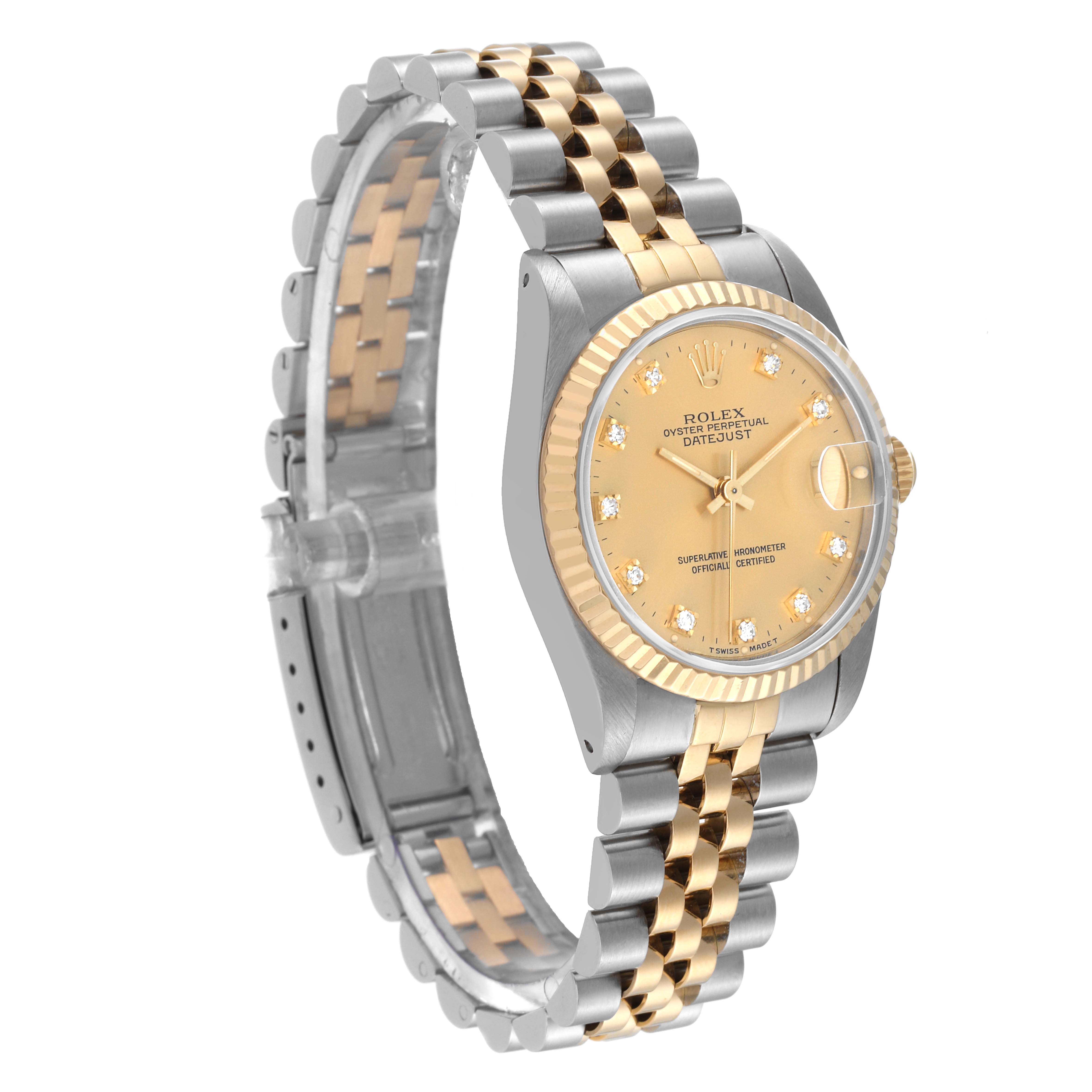 The Rolex Mid-Size 68273 Women
s Steel and Gold (two tone) Champagne Dial 68273 Women
s Steel and Gold (two tone) Champagne Dial Datejust watch is shown at a slight angle, highlighting its two-tone bracelet, fluted bezel, and dial with date display.