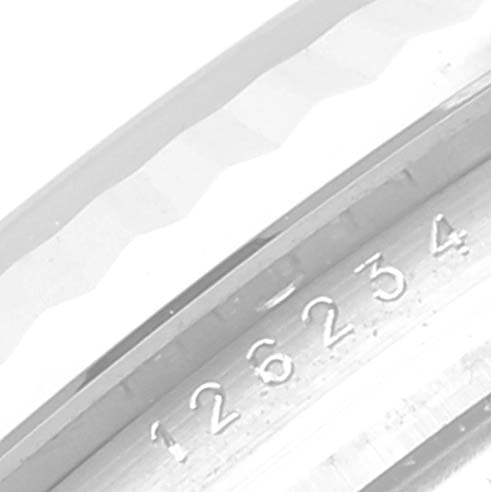 This image shows a close-up of the serial number on the bezel of the Rolex Datejust 126234 Men's Stainless Steel Black Dial 126234 Men's Stainless Steel Black Dial watch.
