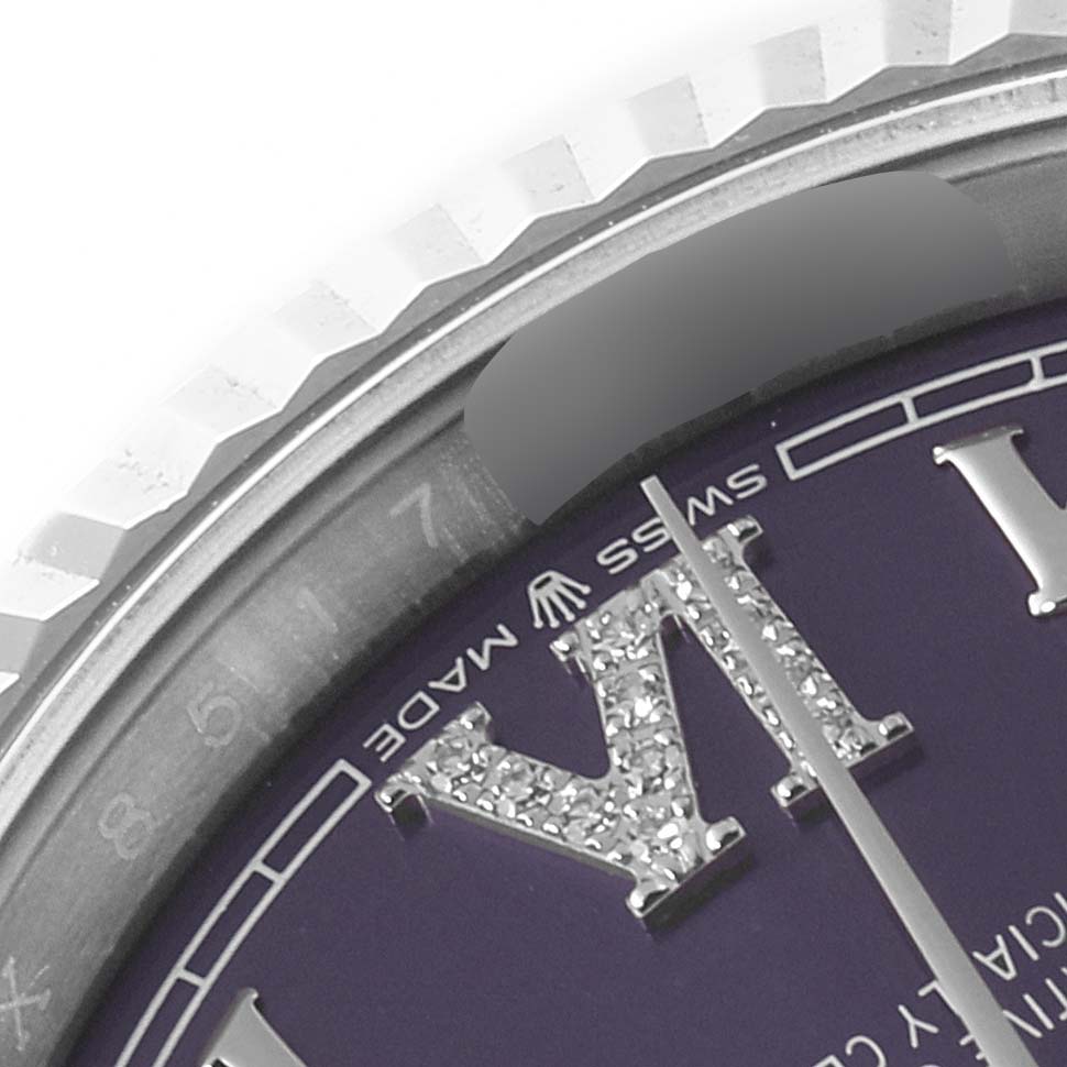 The image shows a close-up of the Rolex Datejust 126234 Men's Stainless Steel Purple Dial 126234 Men's Stainless Steel Purple Dial watch's dial, bezel, and part of the crystal at a detailed angle.
