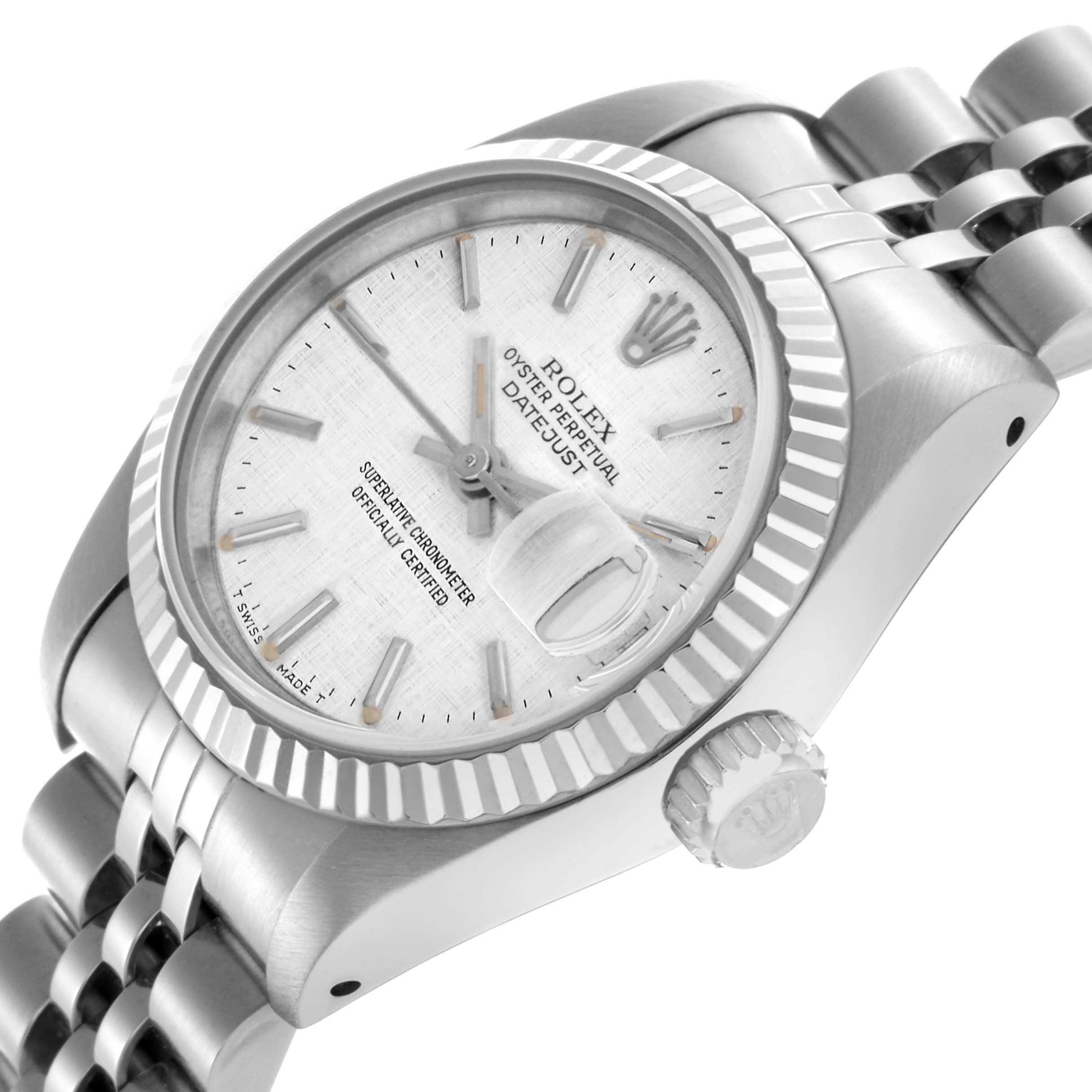 The Rolex Datejust 69174 Women
s Stainless Steel Silver Dial 69174 Women
s Stainless Steel Silver Dial watch is shown at a tilted angle, highlighting the face, bezel, crown, and part of the bracelet.